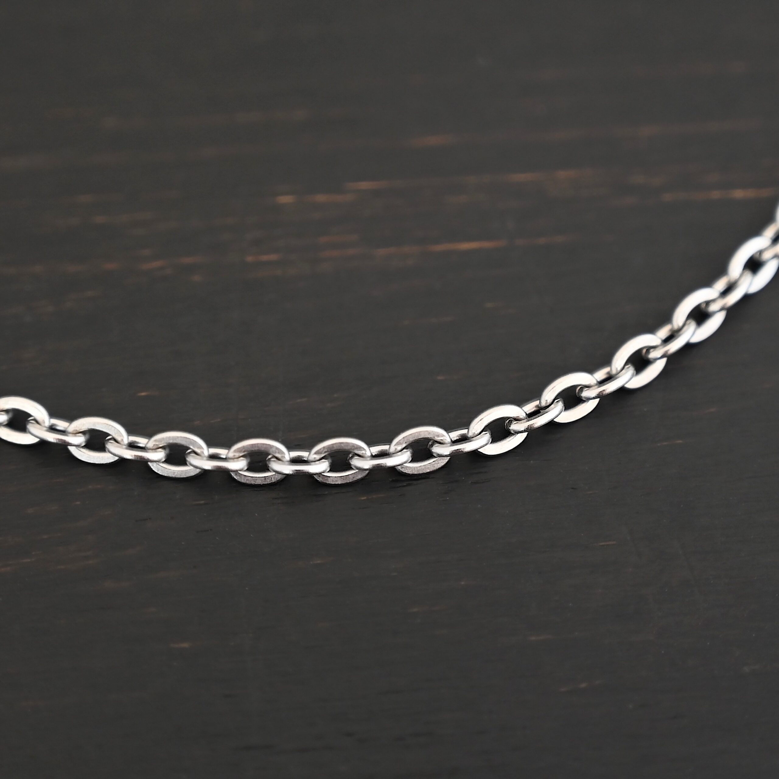 Stainless Steel Simon Chain - shown on dark background