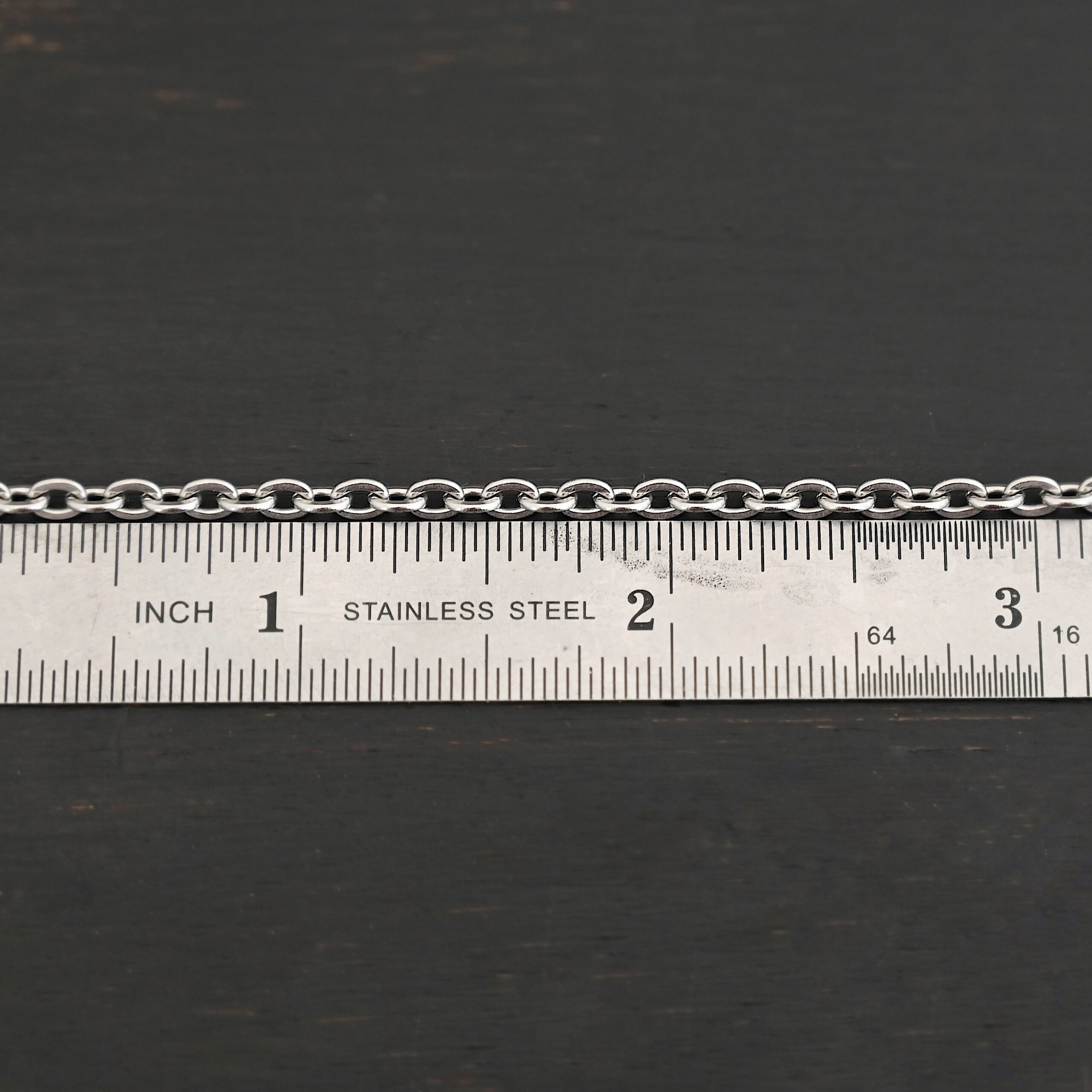 Stainless Steel Simon Chain - shown by ruler