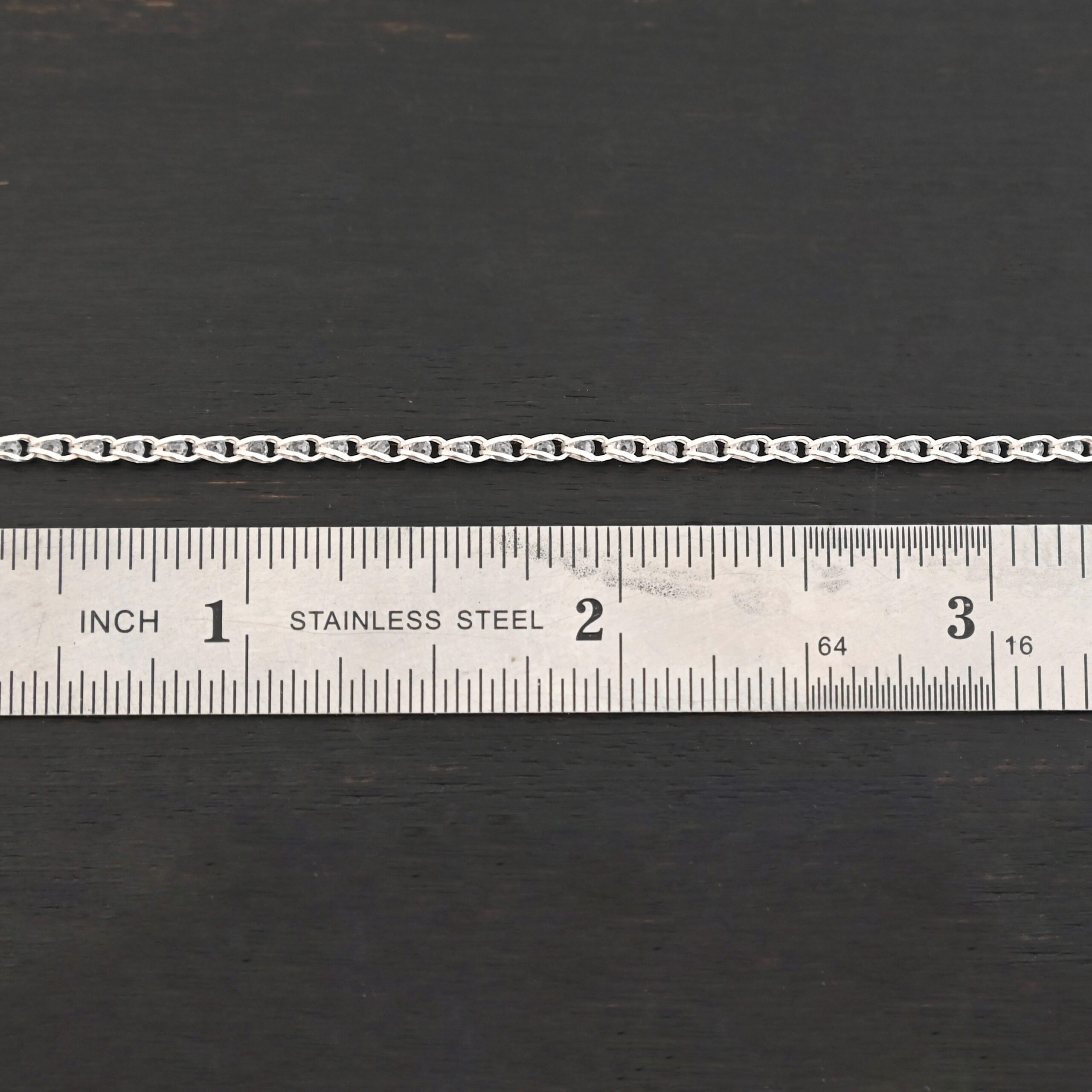 Sterling Silver Scarlett - shiny shown by ruler