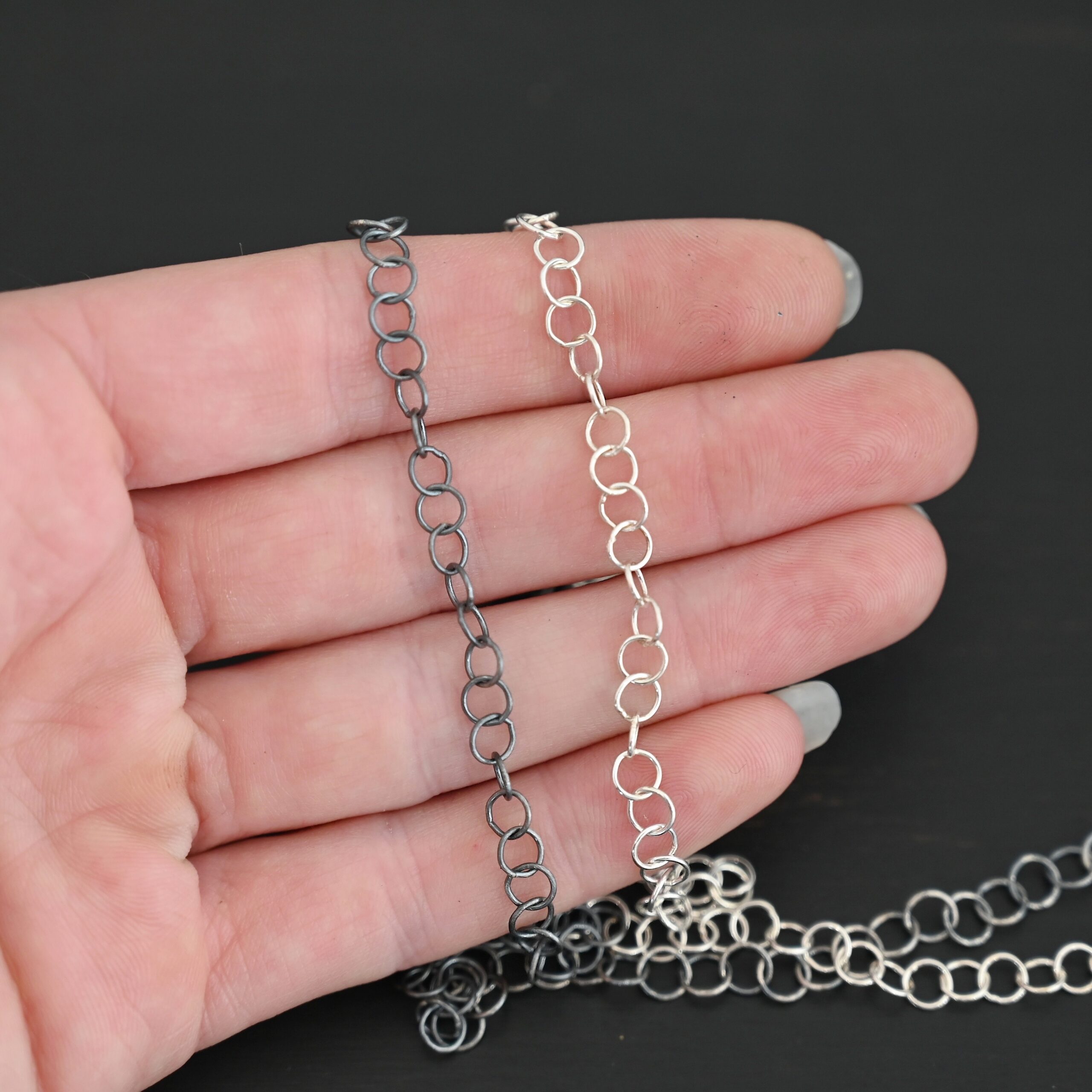 Sterling Silver Round Extension 5mm shiny and oxidized shown in hand