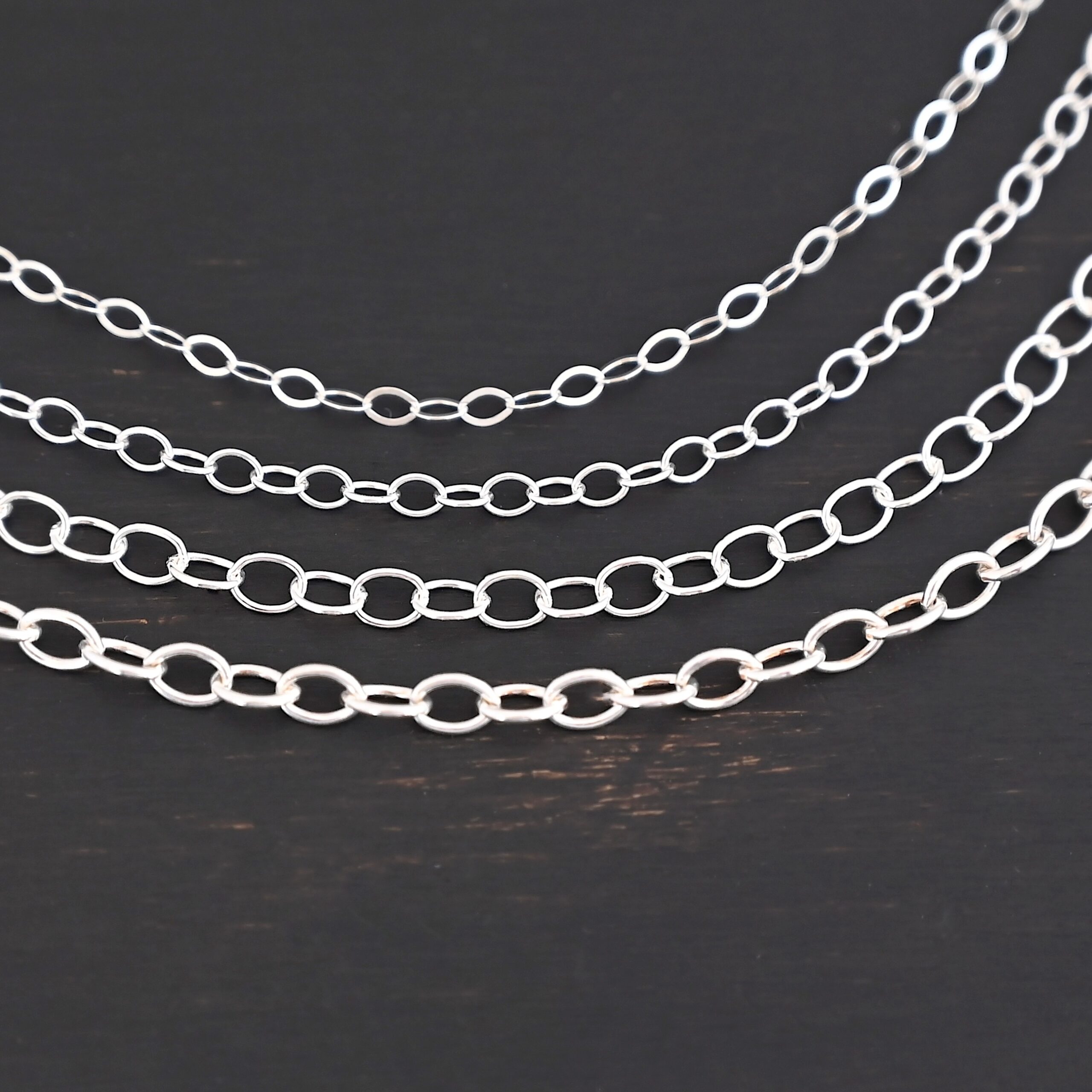 Oval Extension - shiny all four sizes shown on dark background