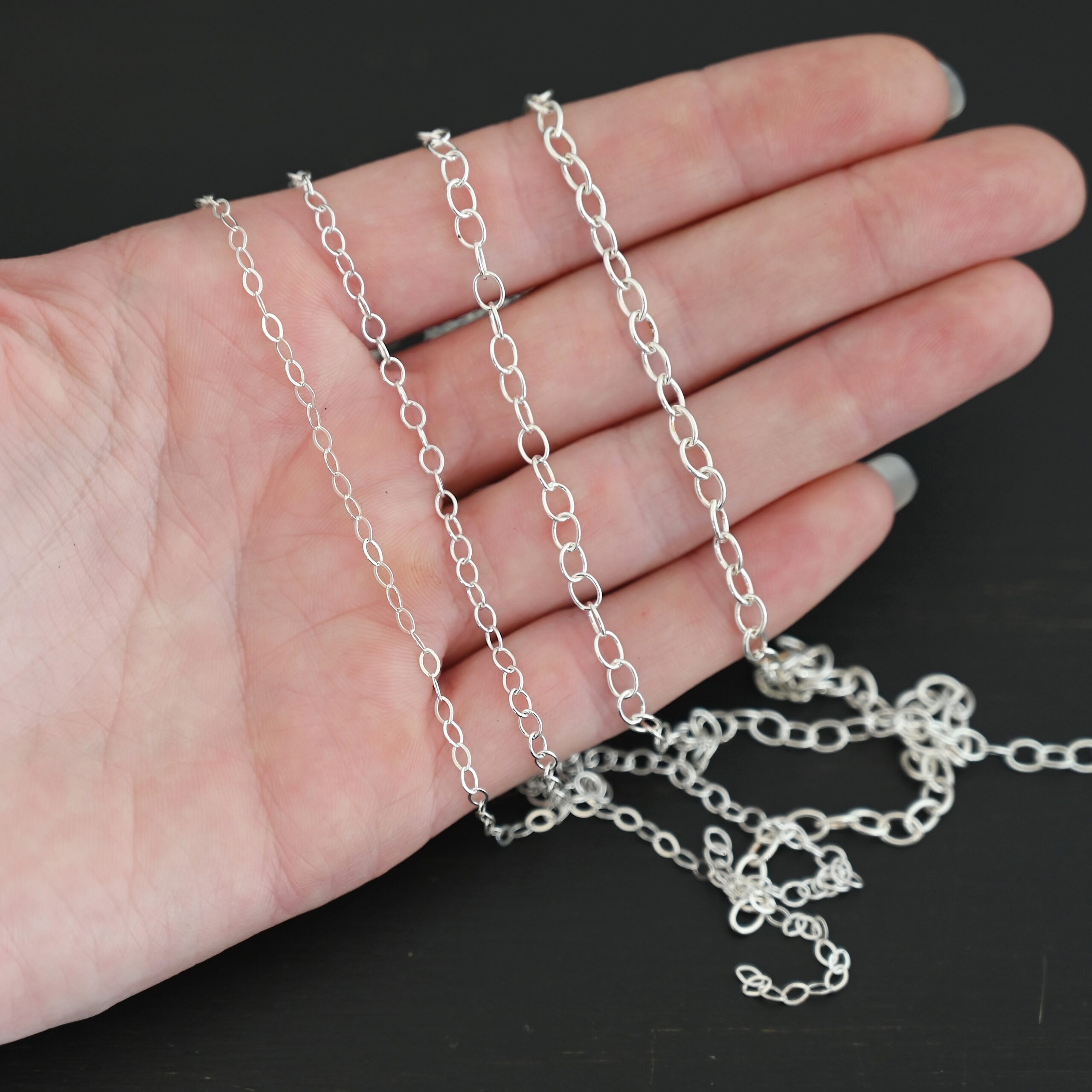 Oval Extension - shiny all four sizes shown in hand