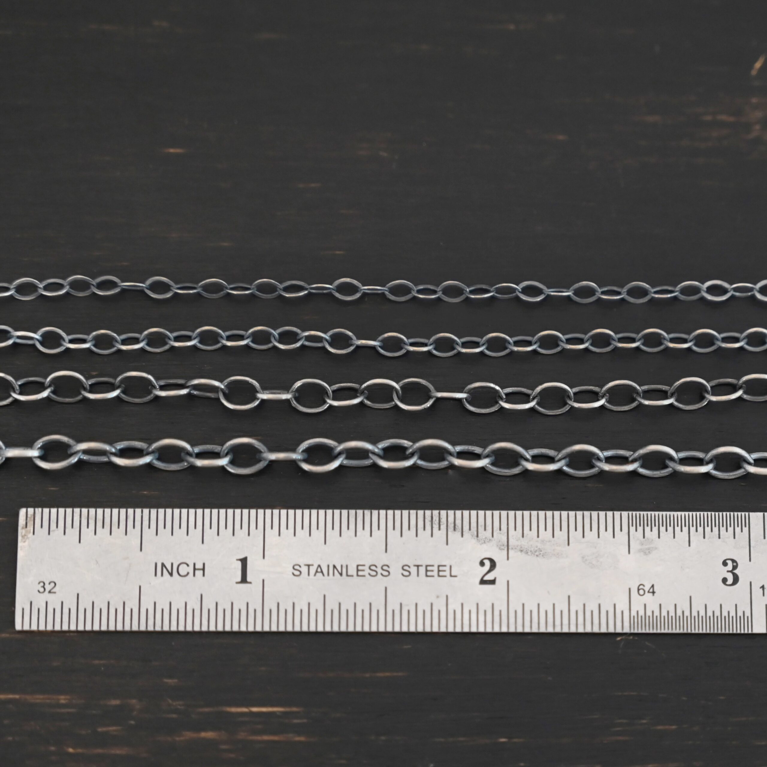Oval Extension - oxidized all four sizes shown by ruler