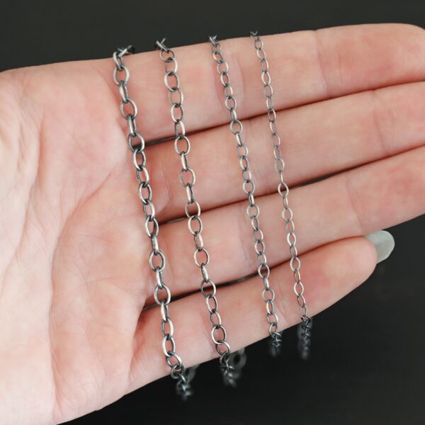 Oval Extension - oxidized all four sizes shown in hand