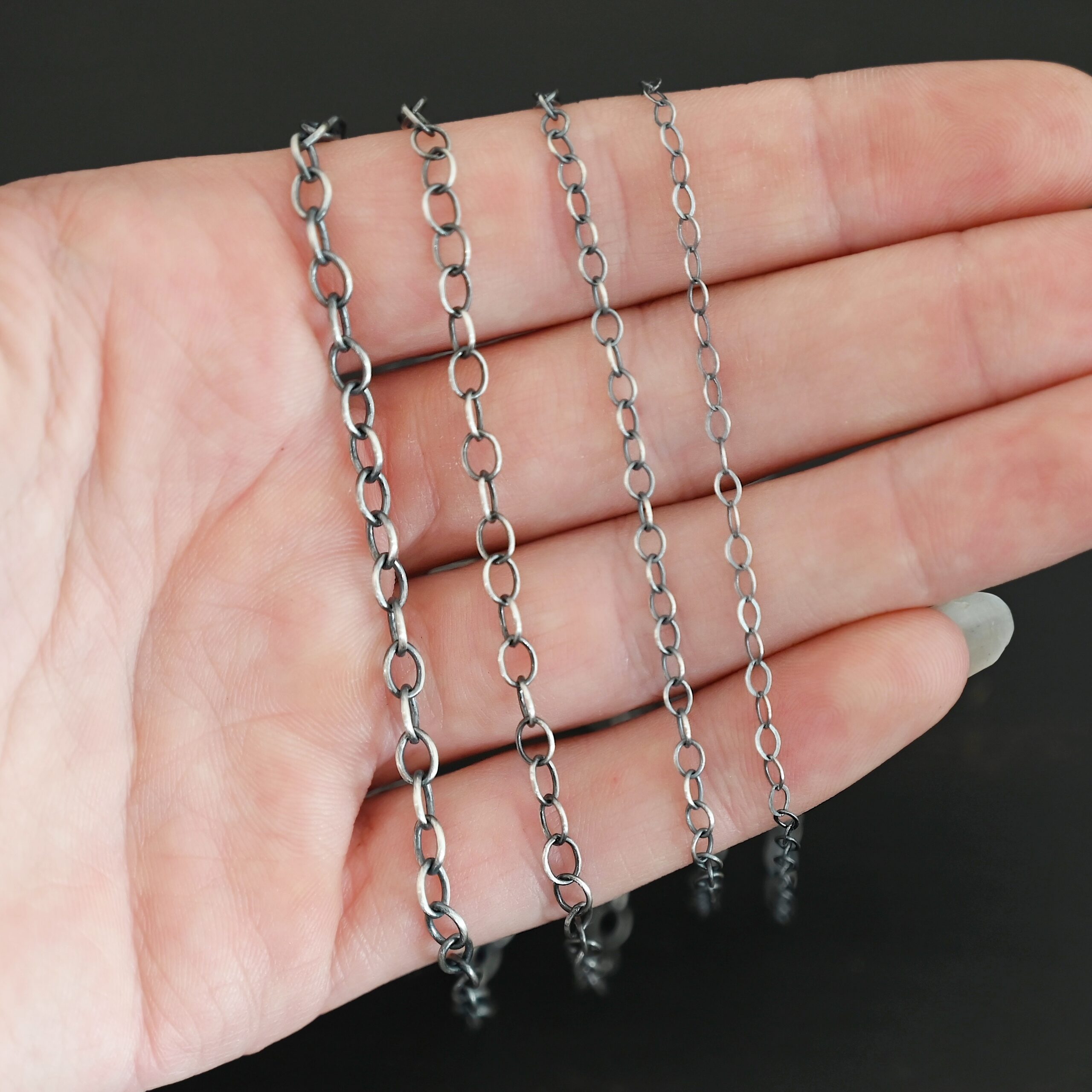 Oval Extension - oxidized all four sizes shown in hand