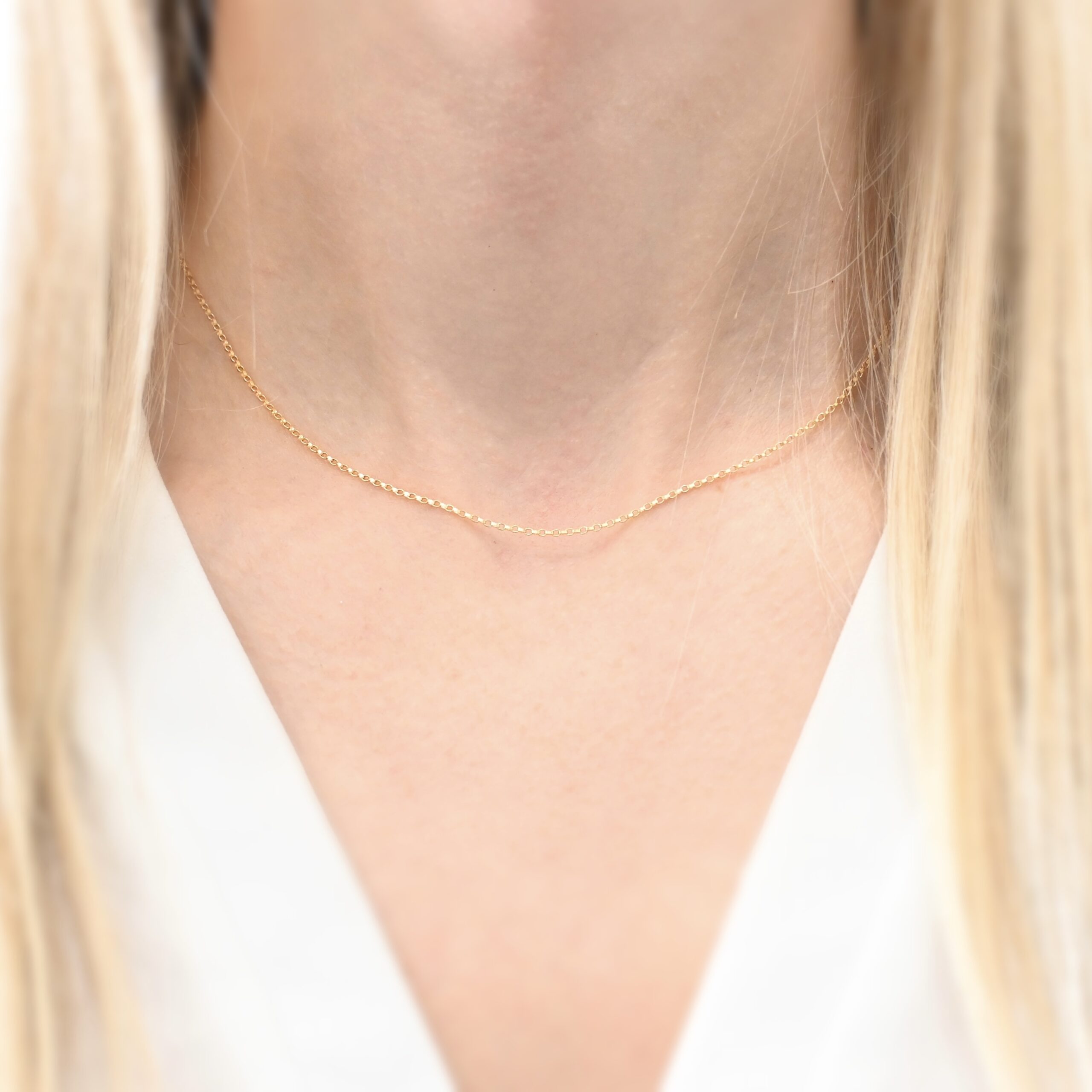 14k gold filled Jessica Rolo Chain - 16-18" shown on model with blonde hair wearing a white shirt