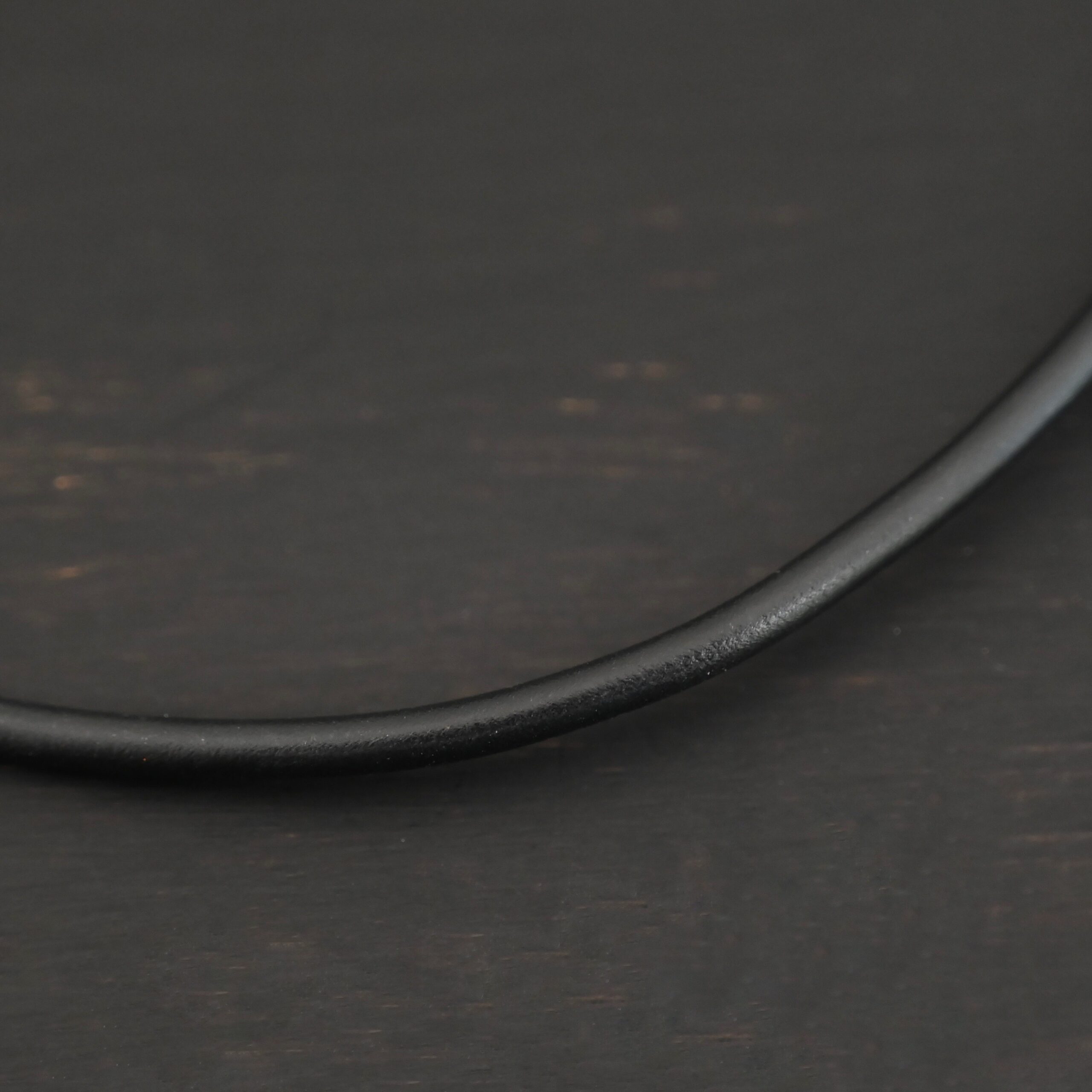 Wren Wire Necklace shown on dark background