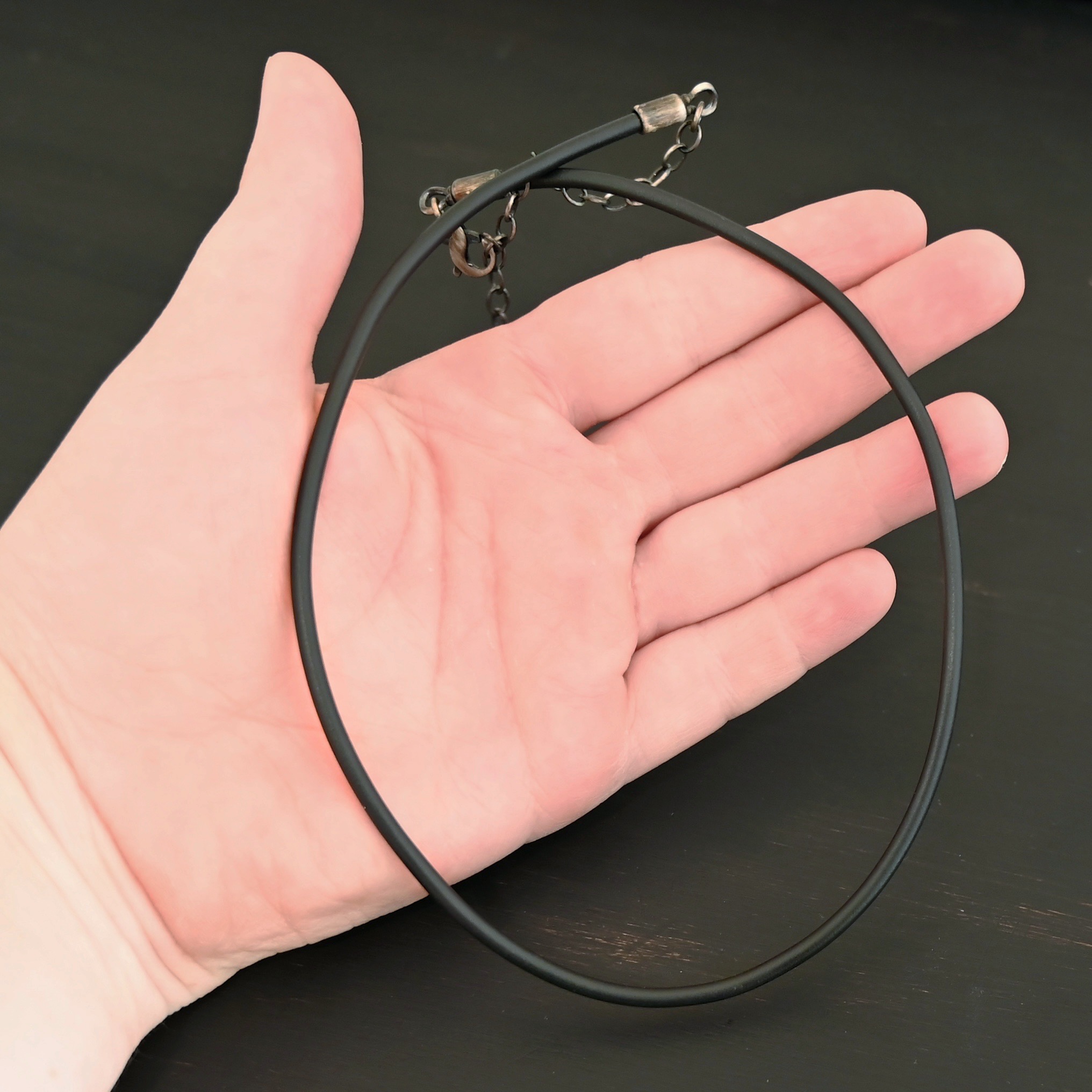 Wren Wire Necklace Oxidized shown in hand