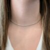 Scarlett Chain Shiny 15-17" shown on model with white shirt and brown hair