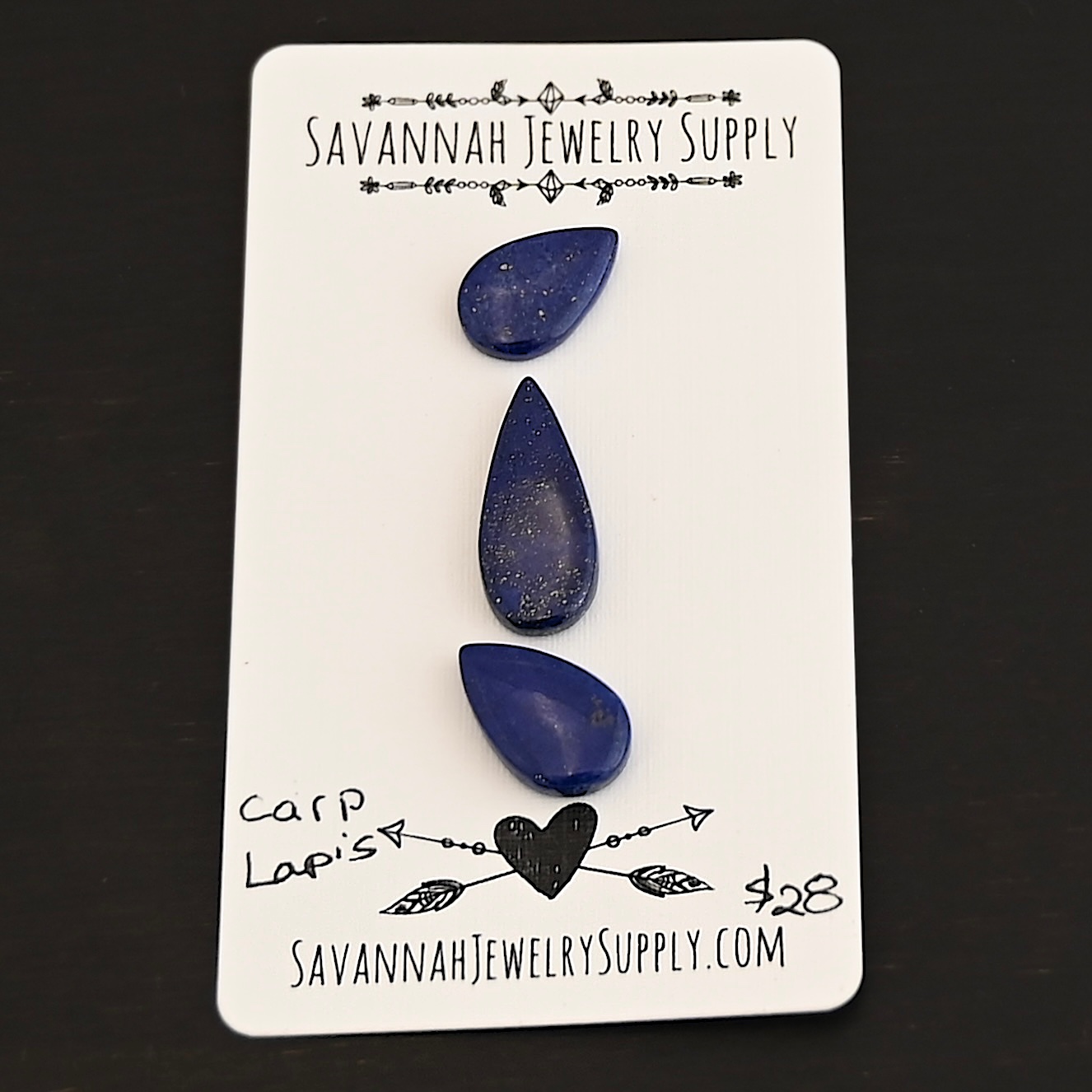 Carp Lapis cabochon parcel shown on business card