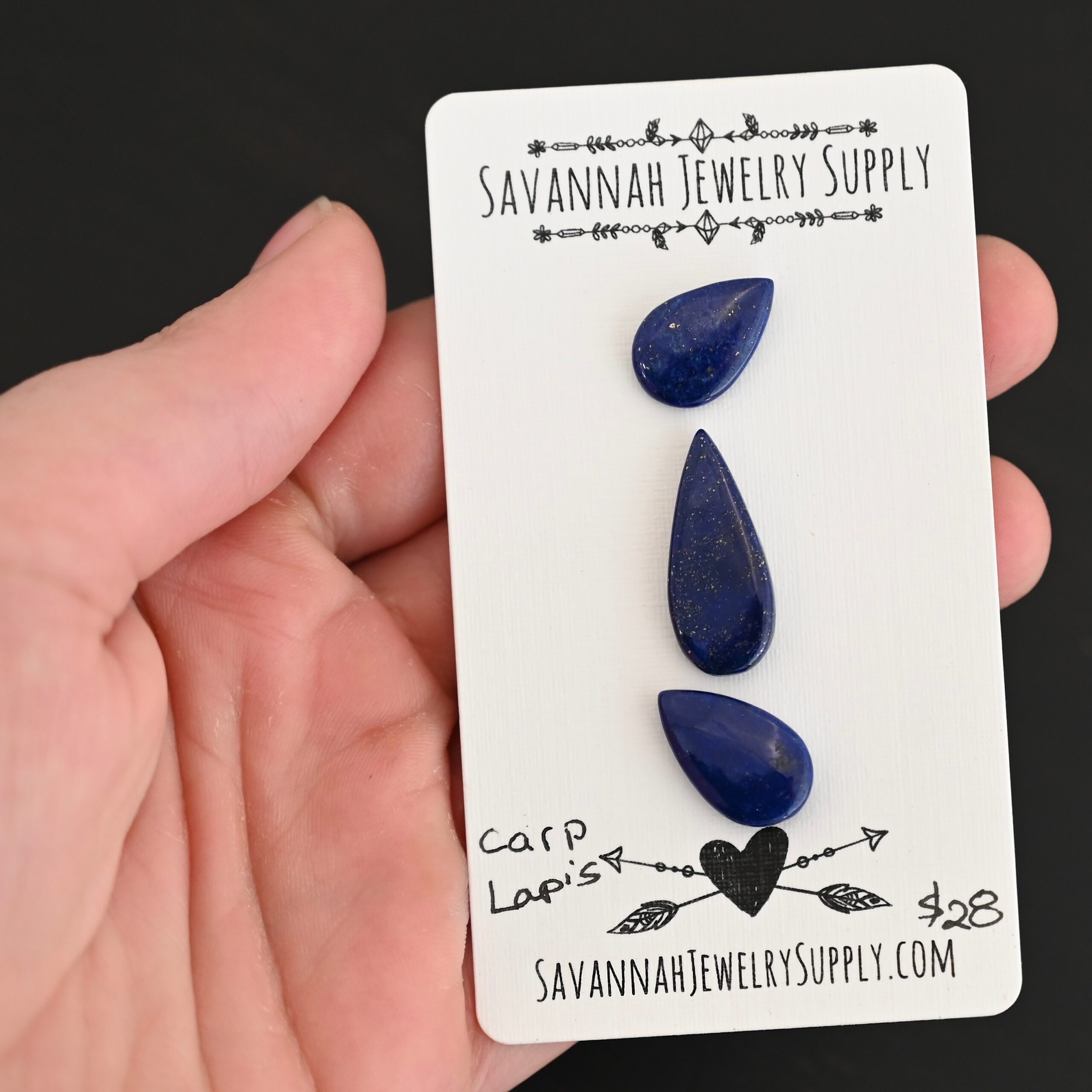 Carp Lapis cabochon parcel shown in hand