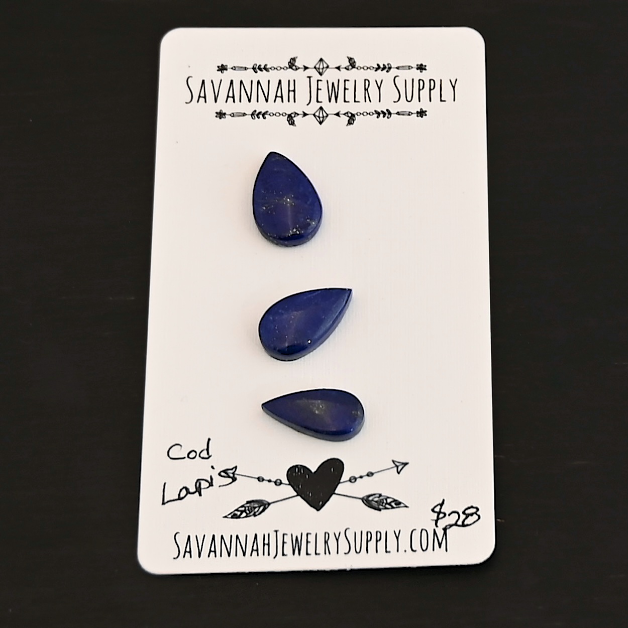 Cod Lapis cabochon parcel shown on business card