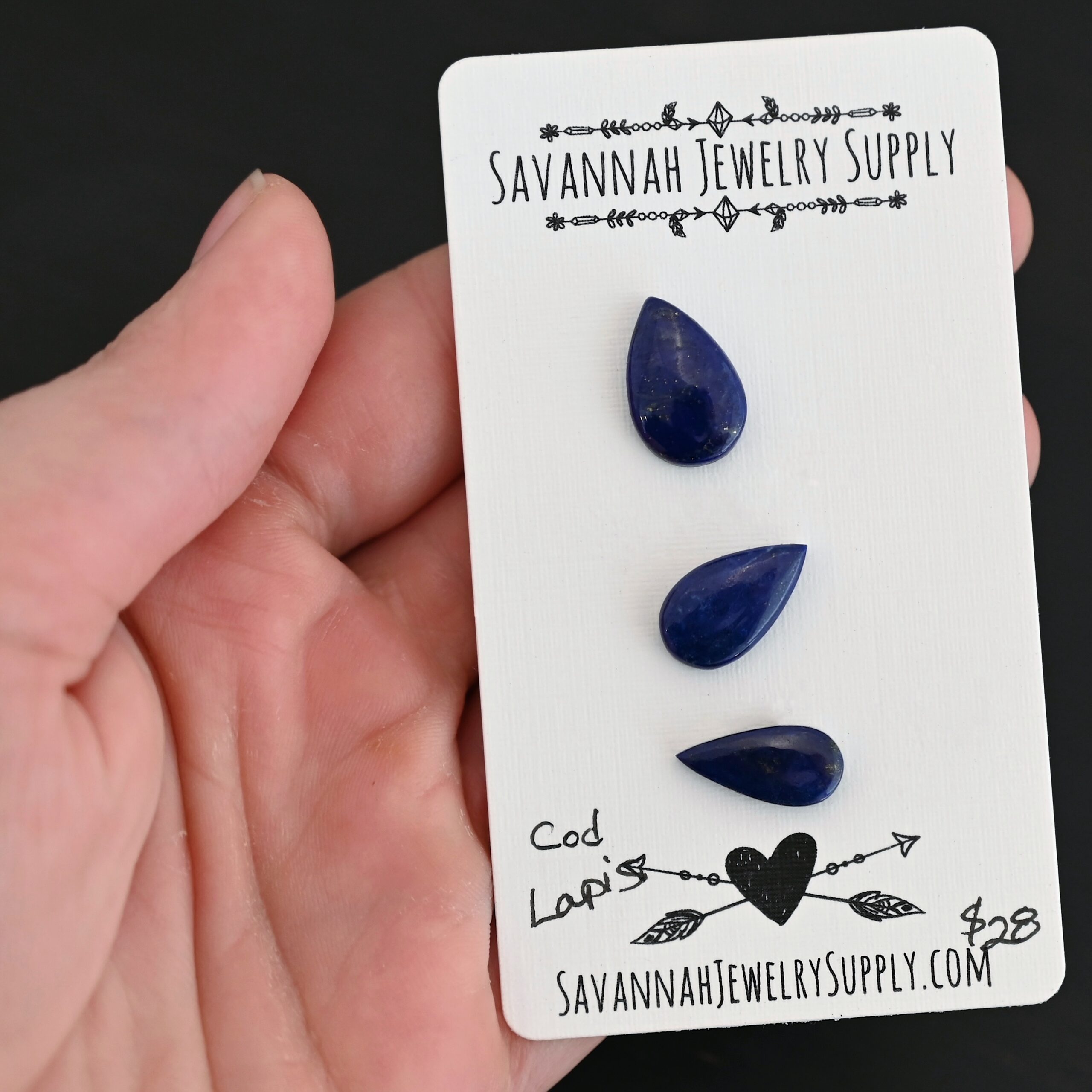 Cod Lapis cabochon parcel shown in hand