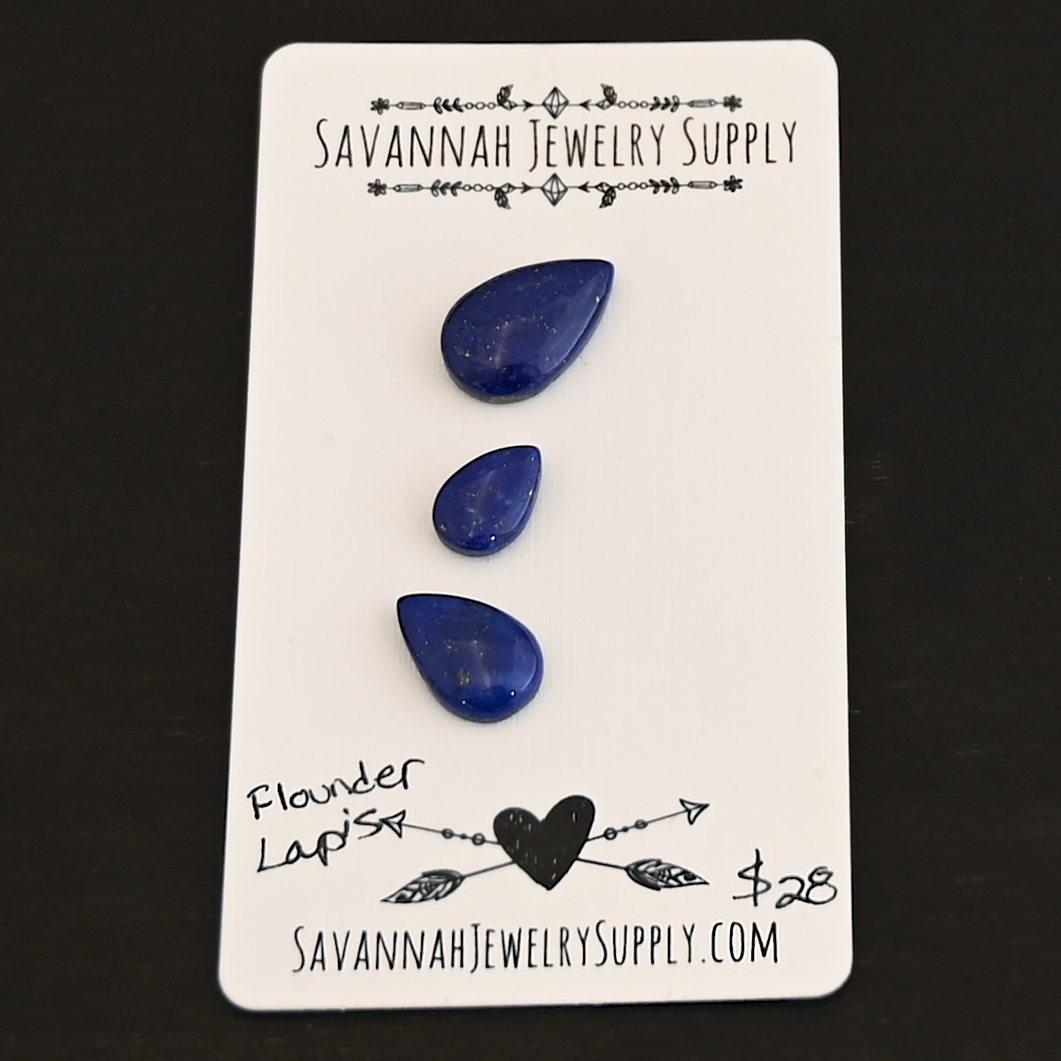 Flounder Lapis cabochon parcel shown on business card