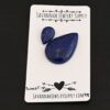 Swordfish Lapis cabochon parcel shown on business card