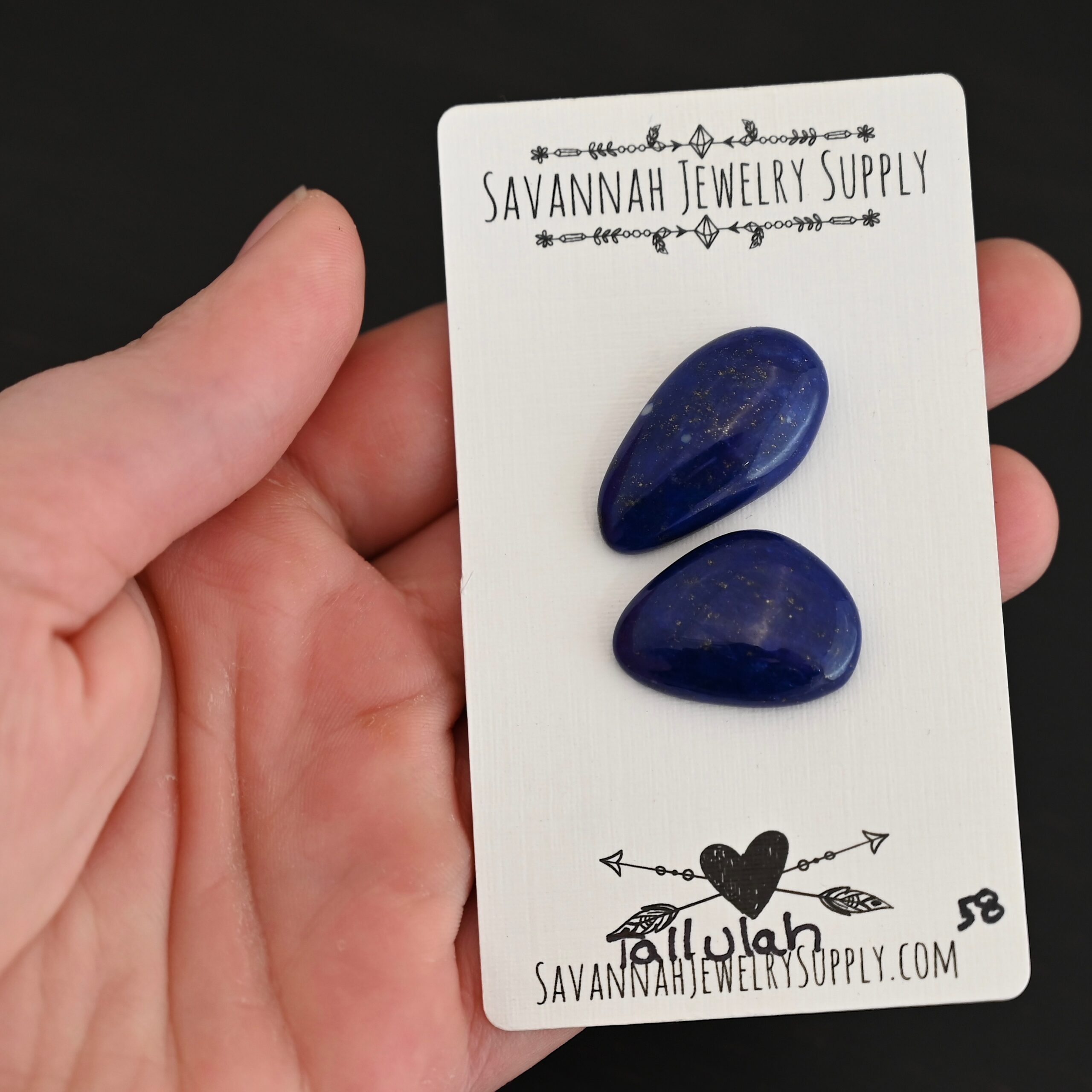Tallulah Lapis cabochon parcel shown in hand