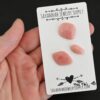 Mai Tai Pink Opal cabochon parcel shown in hand