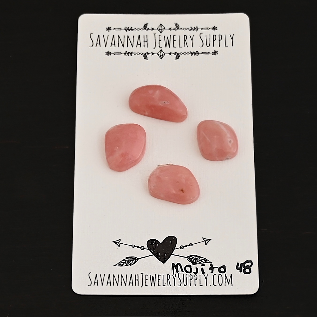 Mojito Pink Opal cabochon parcel shown on business card