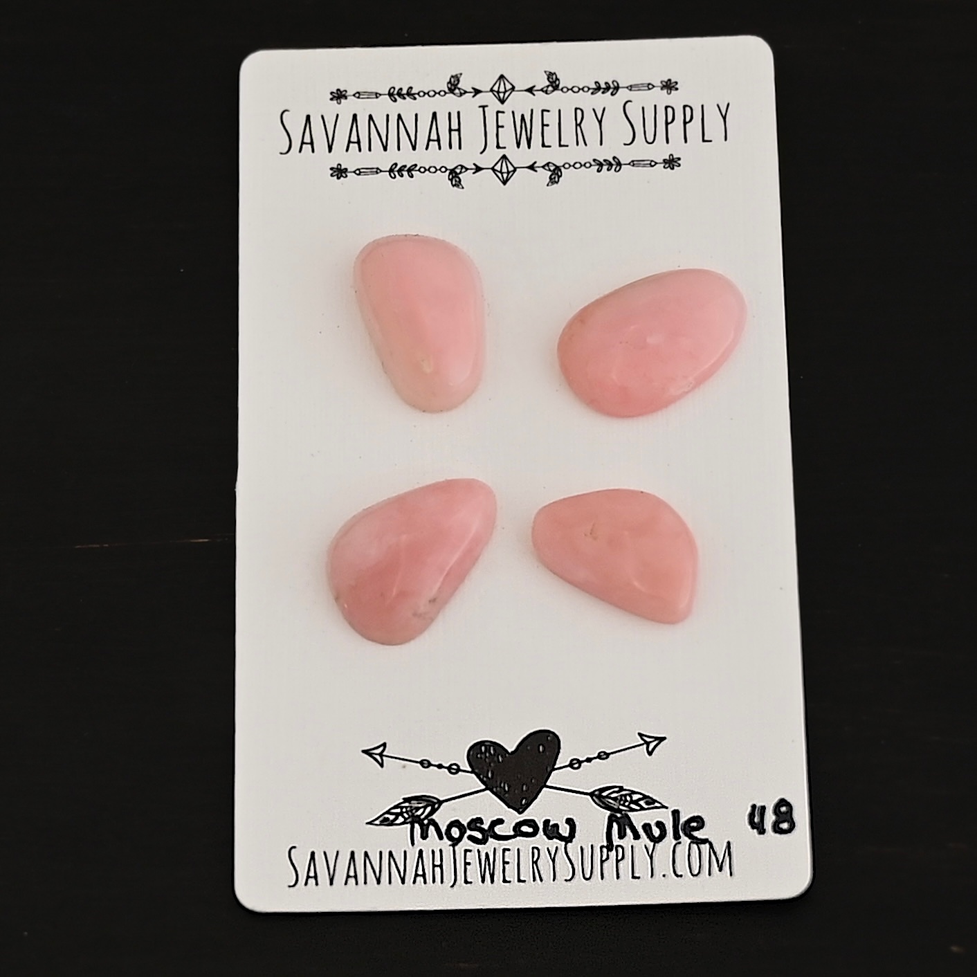 Moscow Mule Pink Opal cabochon parcel shown on business card