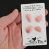 Moscow Mule Pink Opal cabochon parcel shown in hand