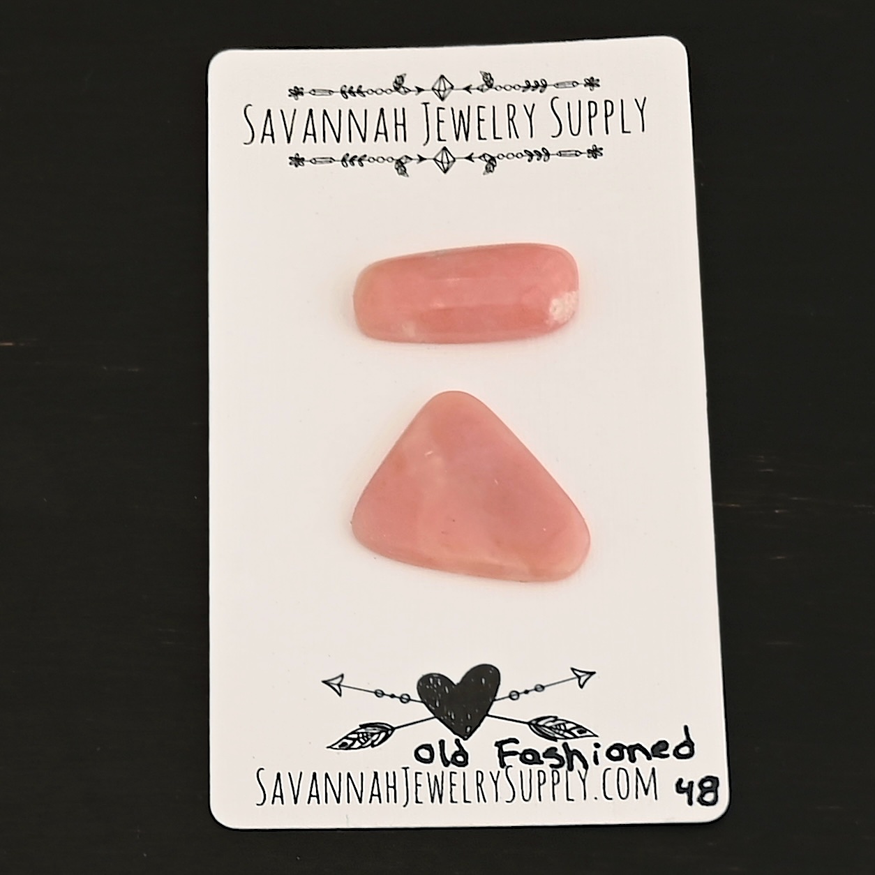 Old Fashioned Pink Opal cabochon parcel shown on business card