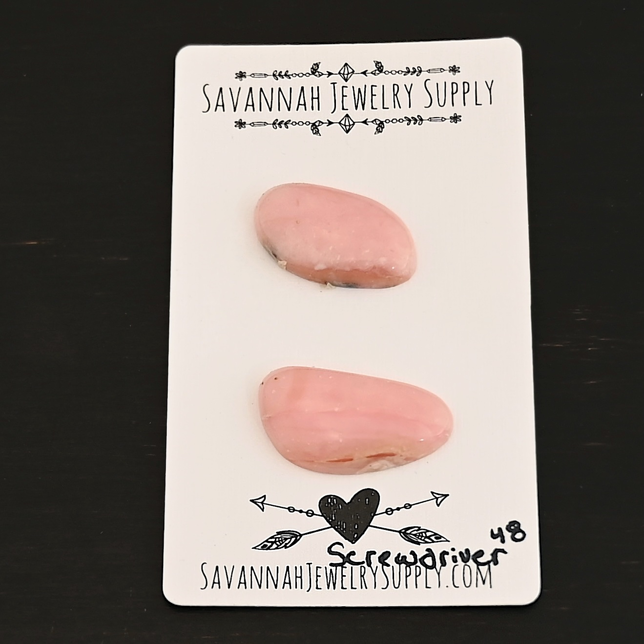 Screwdriver Pink Opal cabochon parcel Screwdriver Pink Opal cabochon parcel shown on business card