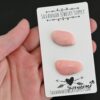 Screwdriver Pink Opal cabochon parcel shown in hand