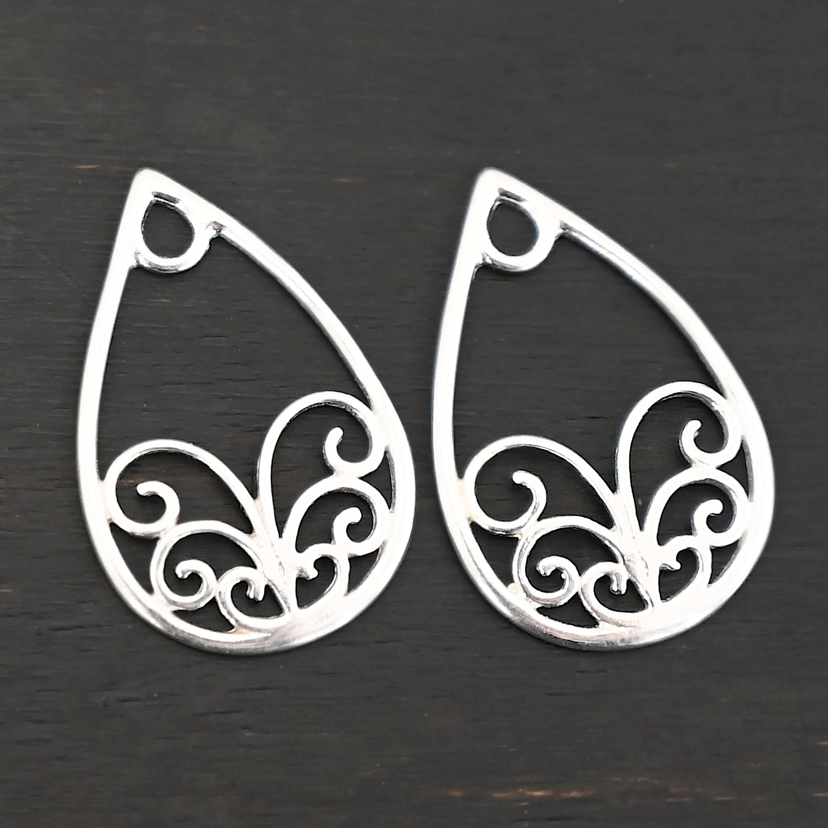 Sterling Silver Tiana Ornate Teardrop Chandelier - shiny smooth shown on dark background