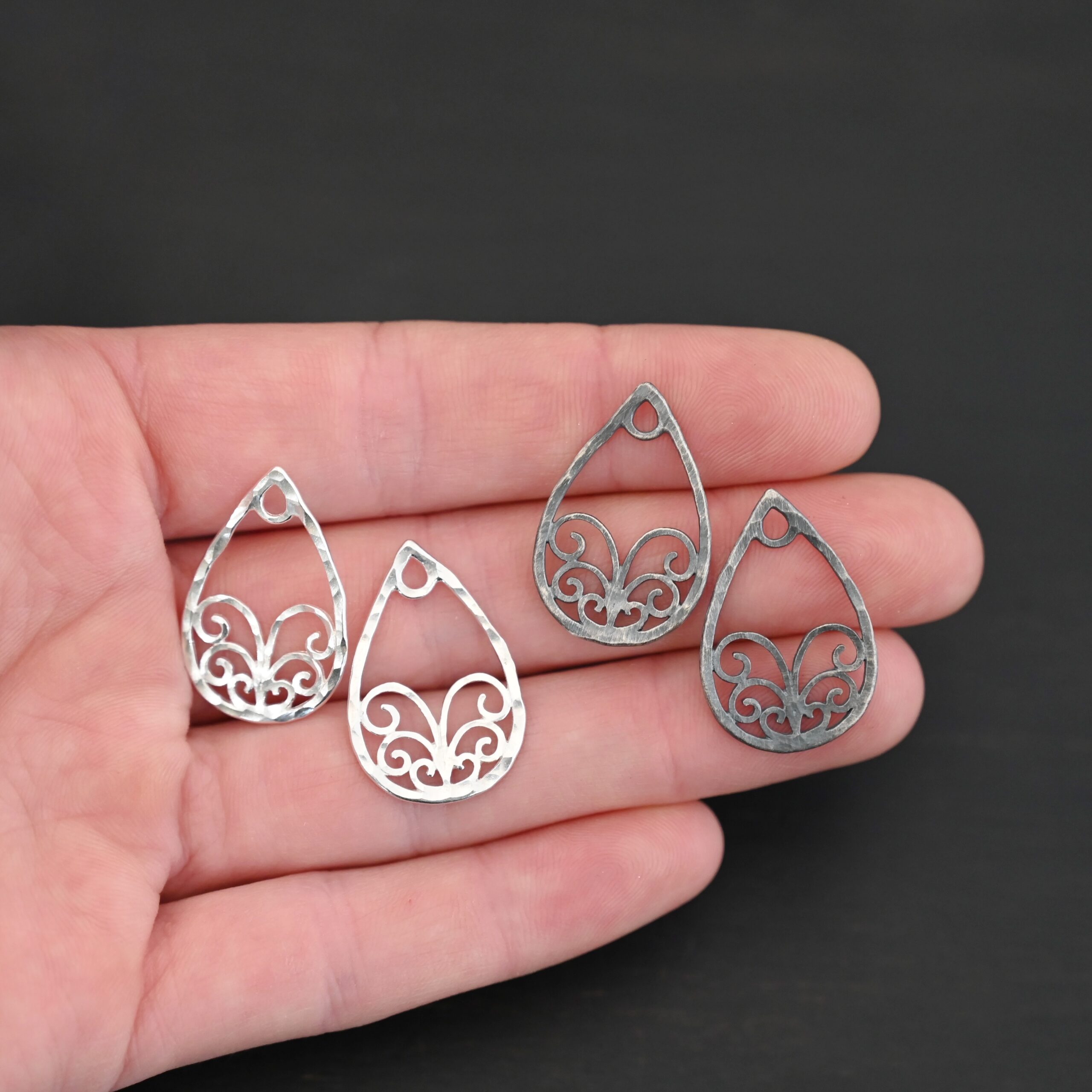 Sterling Silver Tiana Ornate Teardrop Chandelier - hammered shown in hand