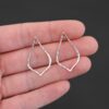 Sterling Silver Tula Petal Teardrop Chandelier shiny hammered shown in hand