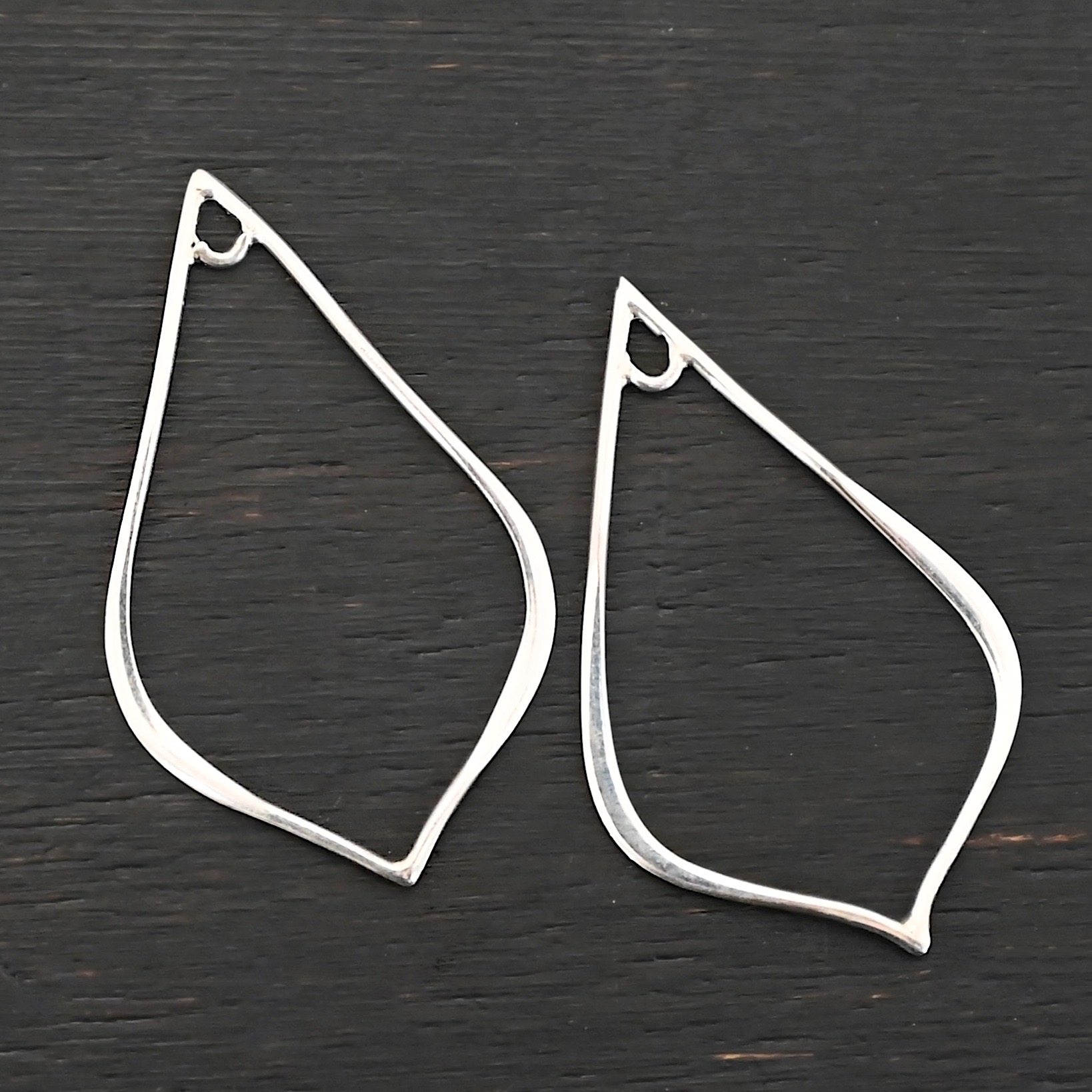 Sterling Silver Tula Petal Teardrop Chandelier shiny smooth shown on dark background