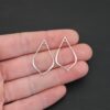 Sterling Silver Tula Petal Teardrop Chandelier shiny smooth shown in hand