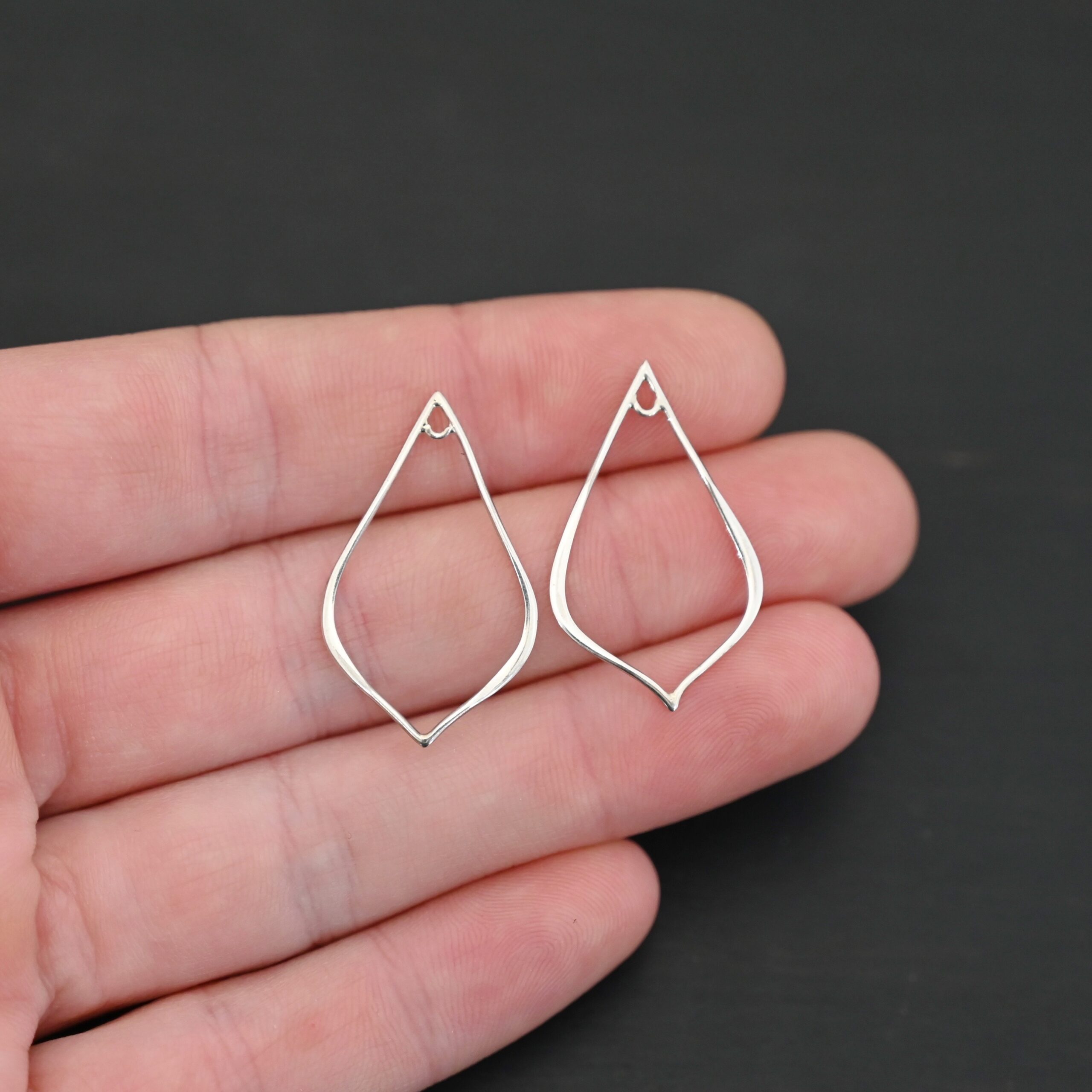 Sterling Silver Tula Petal Teardrop Chandelier shiny smooth shown in hand