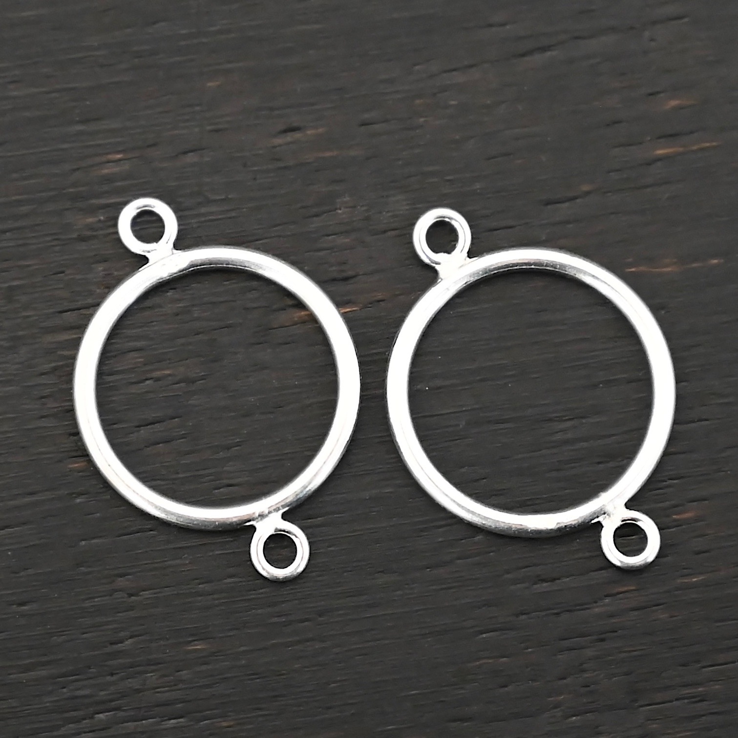 Taylor Round Chandelier shiny smooth Sterling Silver Taylor Round Chandelier shiny smooth shown on dark background