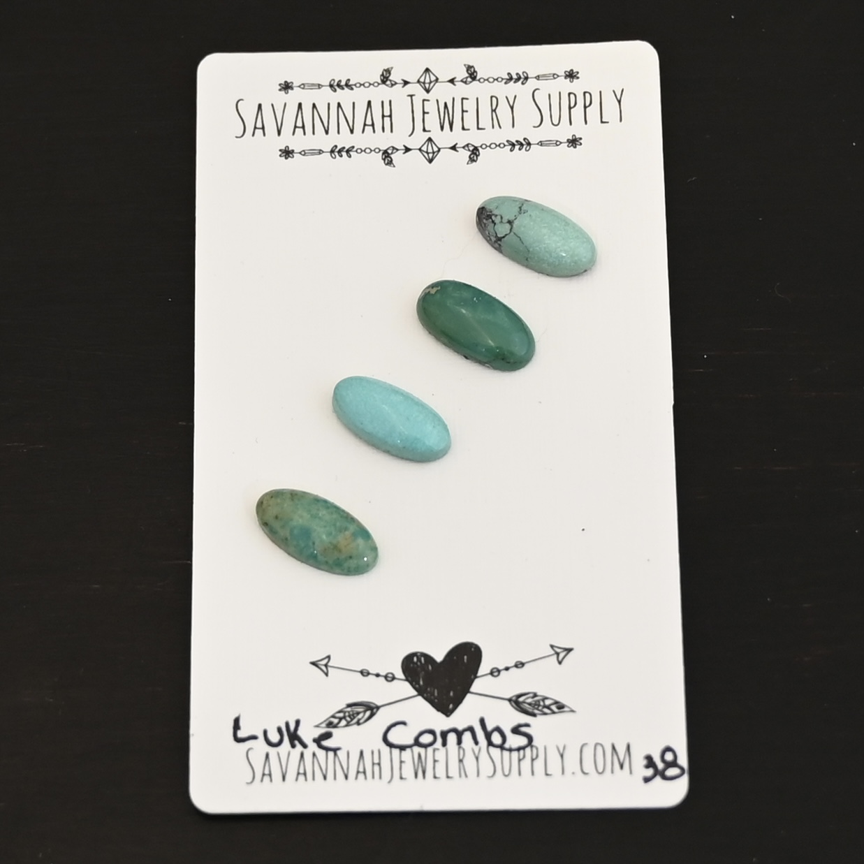 Luke Combs Turquoise Cabochon Parcel shown on business card