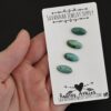 Rodney Atkins Turquoise Cabochon Parcel shown in hand