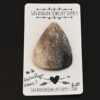 Palm Root Fossil Cabochon shown on business card