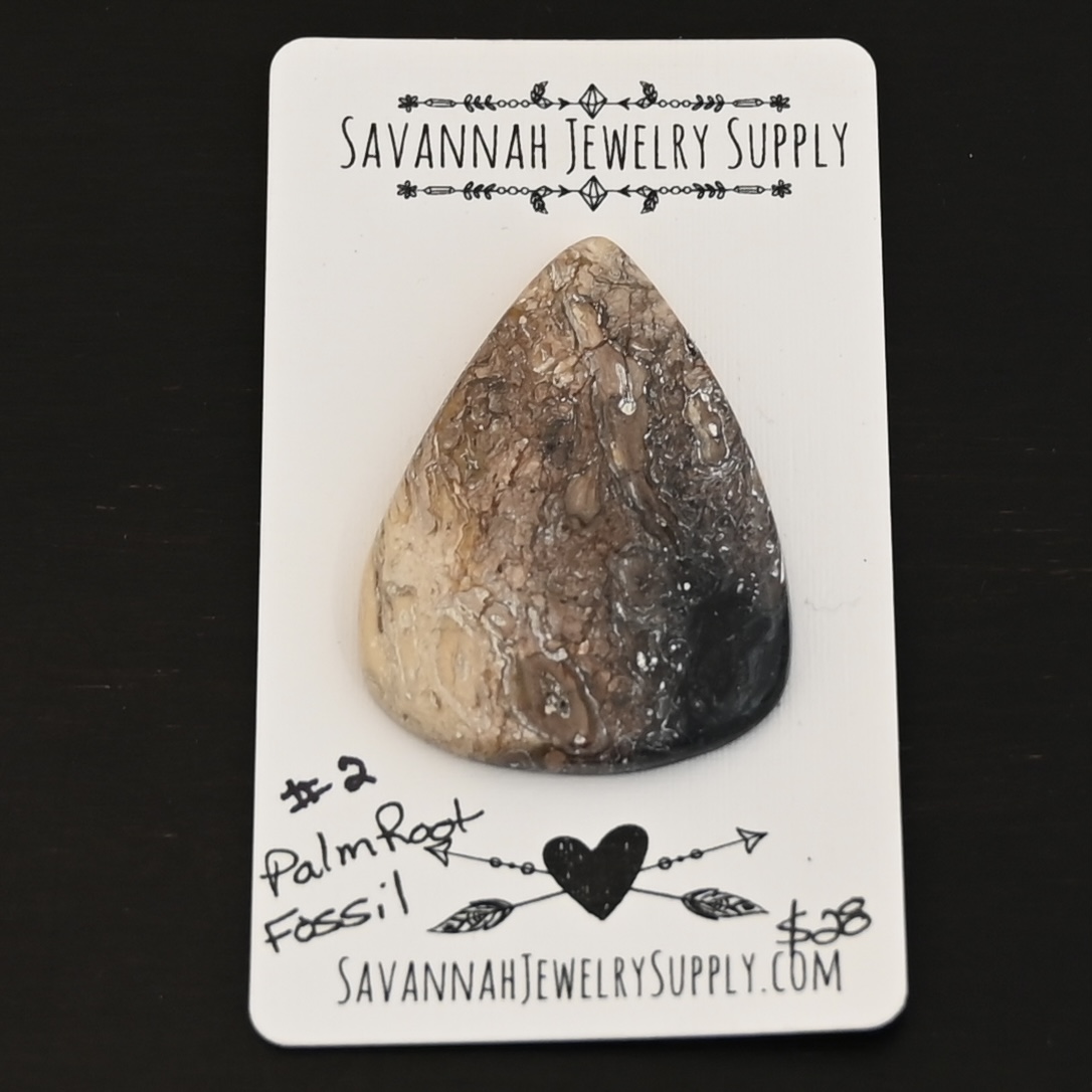 Palm Root Fossil Cabochon Palm Root Fossil Cabochon shown on business card