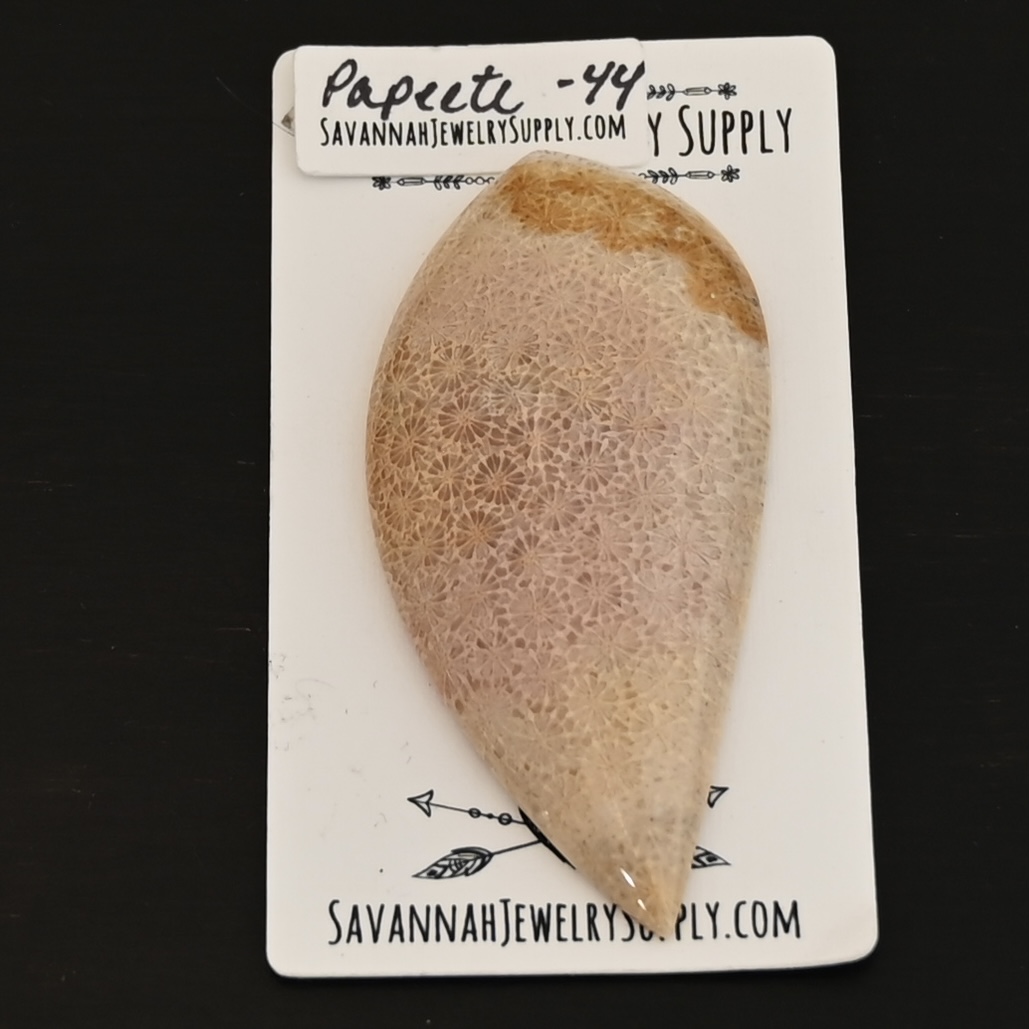 Papeete - Bali Star Coral Fossil Cabochon shown on business card