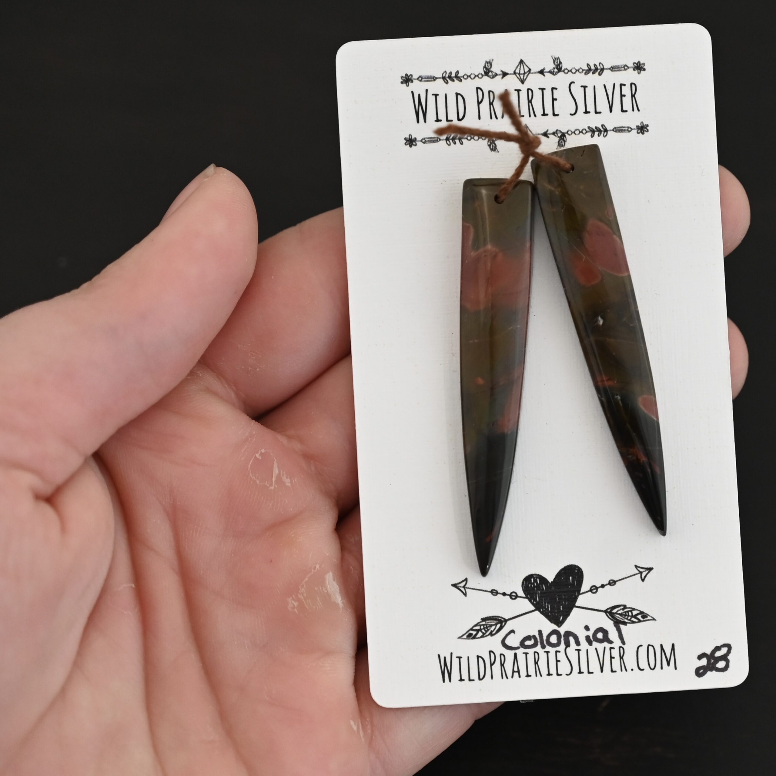 Colonial - Drilled Jasper Pair shown in hand