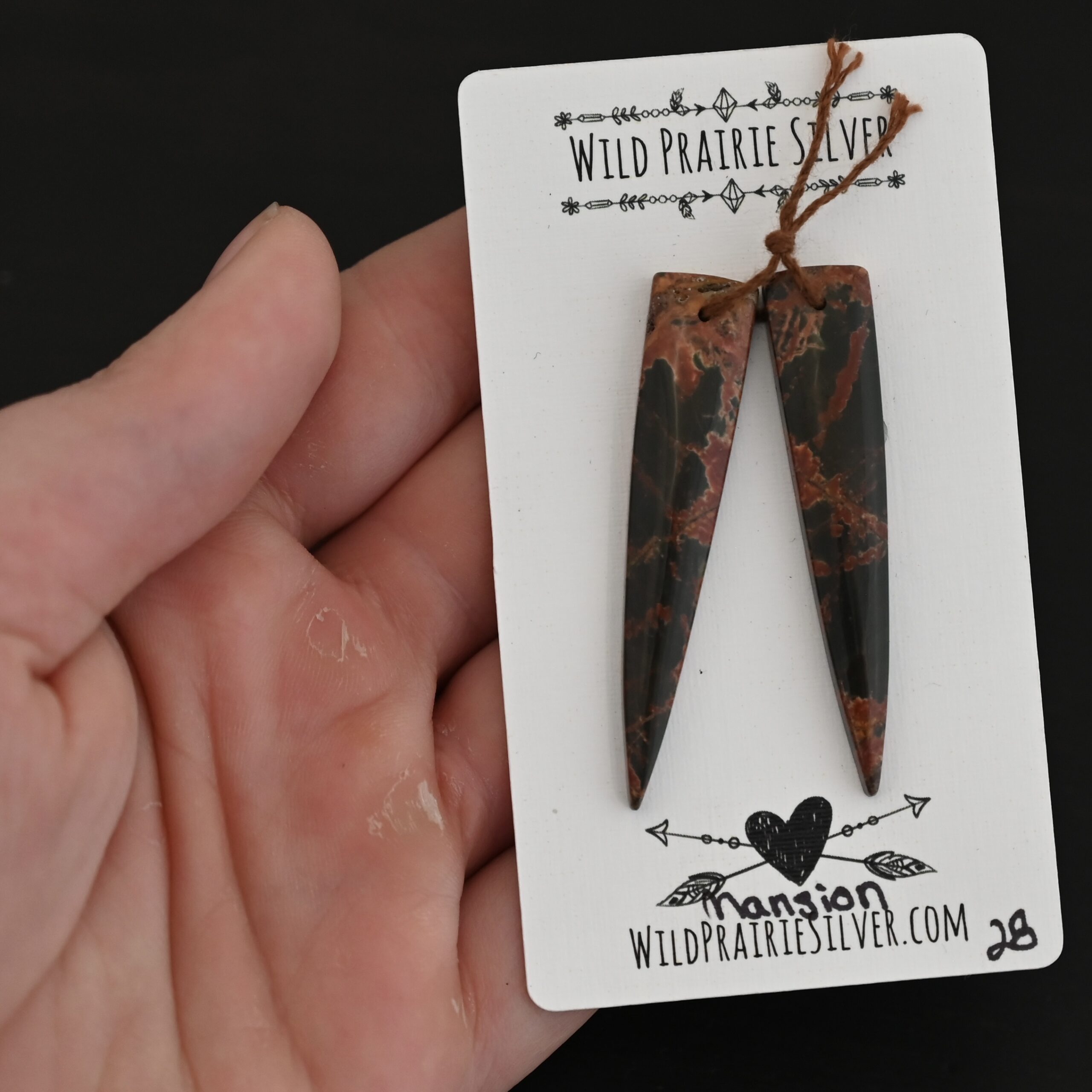 Mansion - Drilled Jasper Pair shown in hand