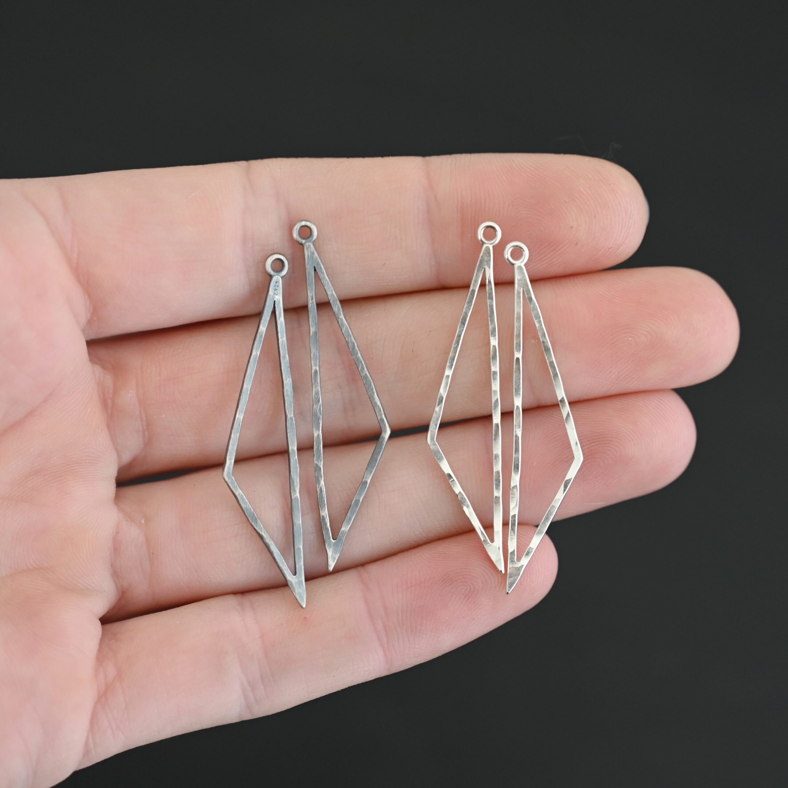 sterling silver Trace Triangle Chandelier 43x8.5mm oxidized and shiny hammered shown in hand