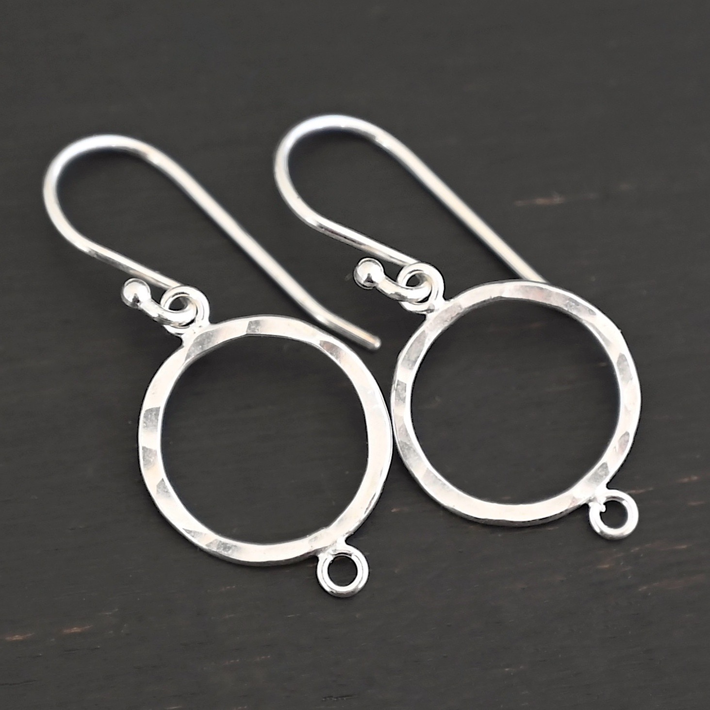 Taylor Round Chandelier shiny hammered with ear wires sterling silver Taylor Round Chandelier shiny hammered with ear wires shown on dark background