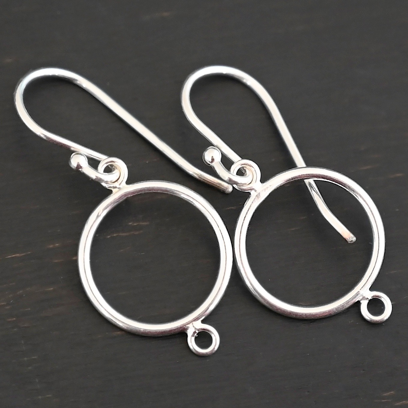 Taylor Round Chandelier shiny smooth with ear wires sterling silver Taylor Round Chandelier shiny smooth with ear wires shown on dark background