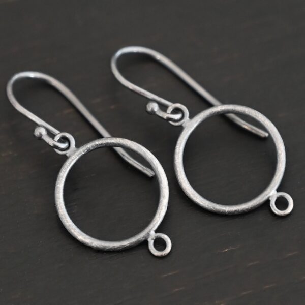 sterling silver Taylor Round Chandelier oxidized smooth with ear wires shown on dark background