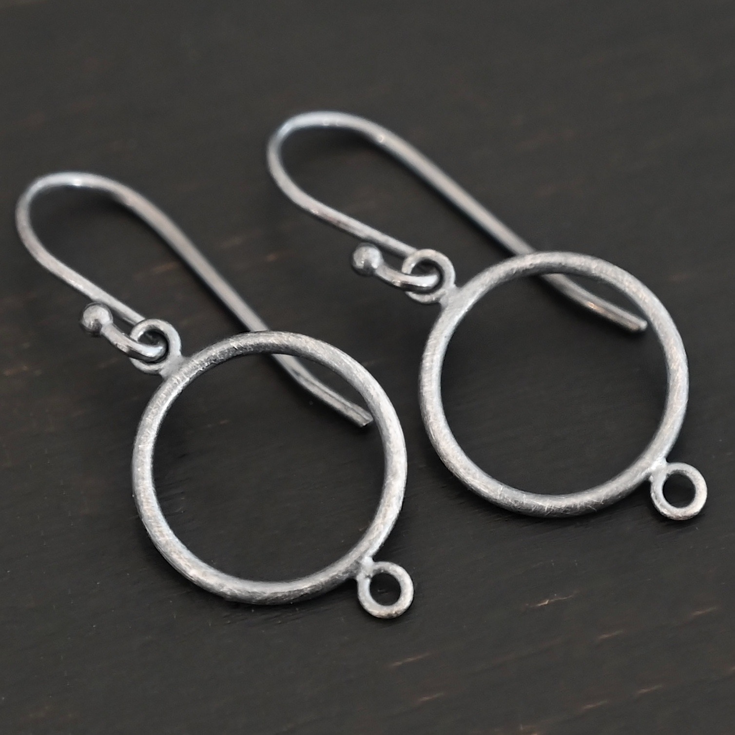 Taylor Round Chandelier oxidized smooth with ear wires sterling silver Taylor Round Chandelier oxidized smooth with ear wires shown on dark background