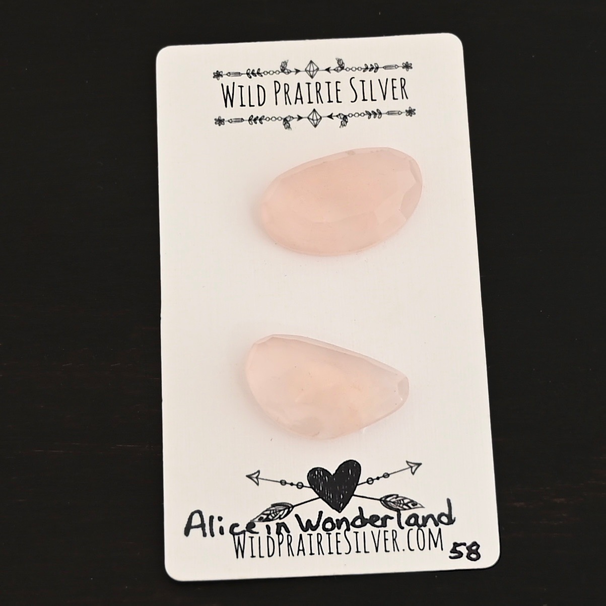 Alice in Wonderland Rose Cut Rose Quartz Cabochon Parcel shown on business card