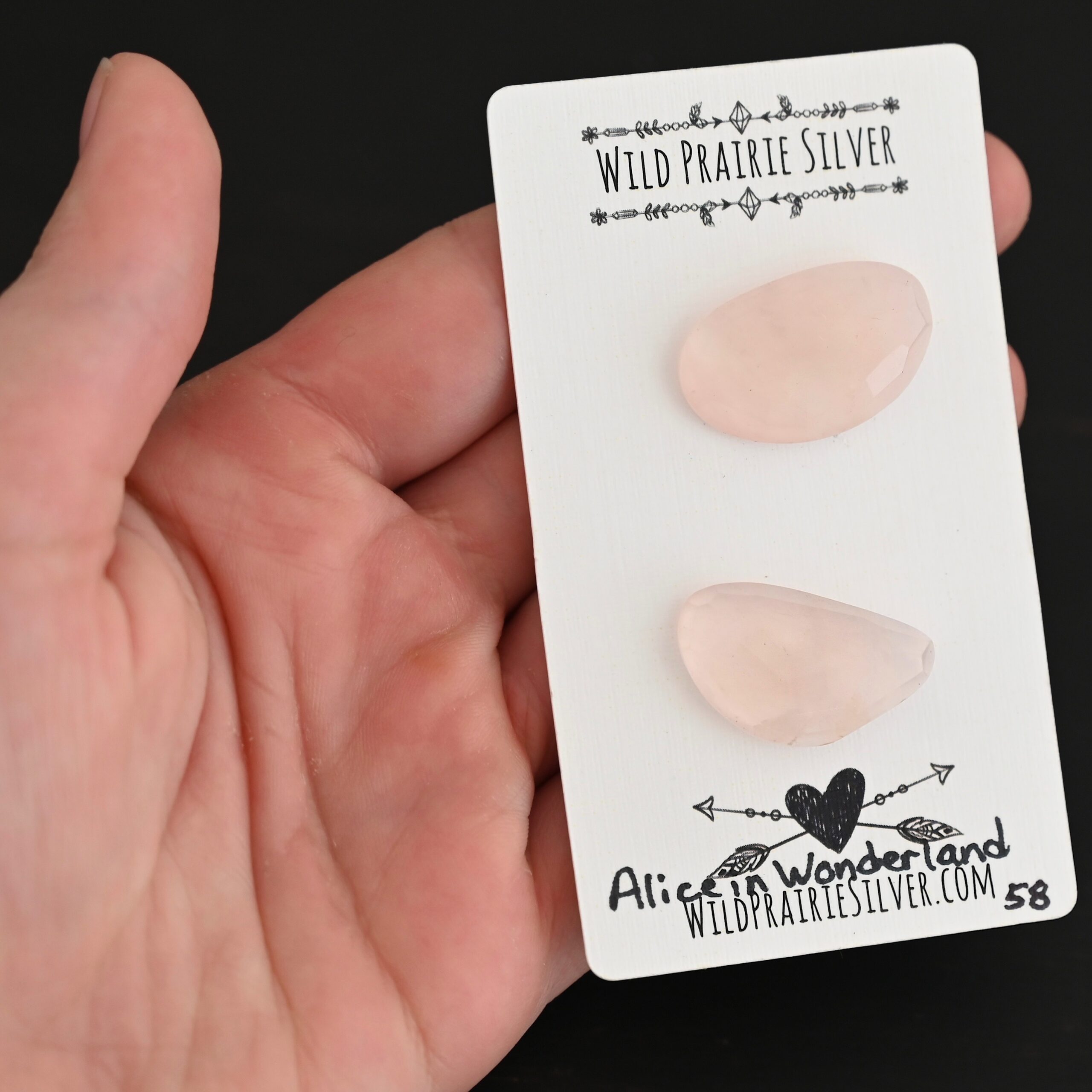 Alice in Wonderland Rose Cut Rose Quartz Cabochon Parcel shown in hand