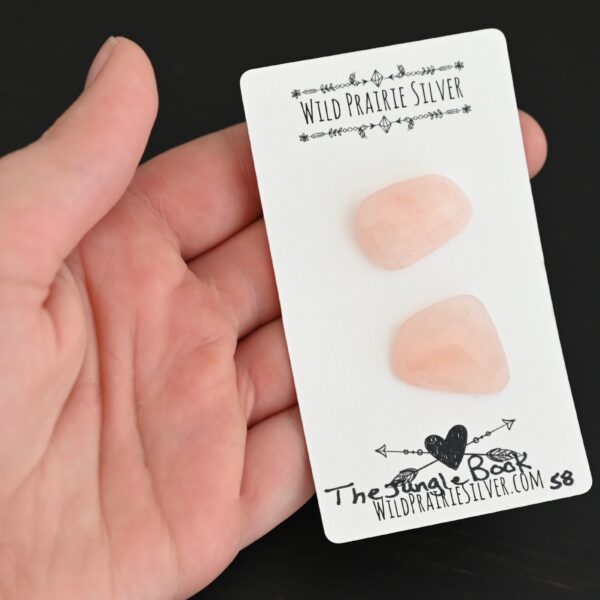 The Jungle Book Rose Cut Rose Quartz Cabochon Parcel shown in hand