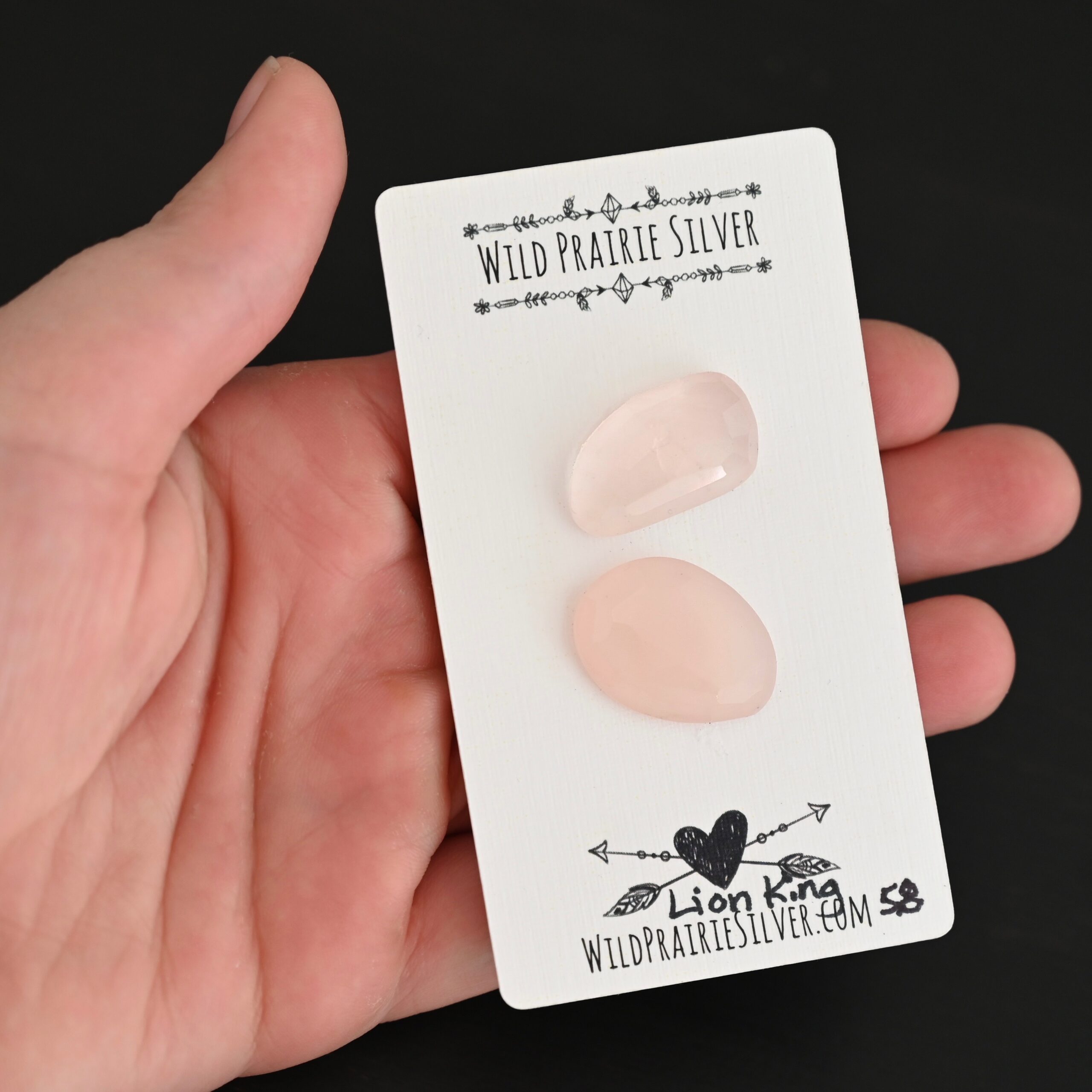 Lion King Rose Cut Rose Quartz Cabochon Parcel shown in hand